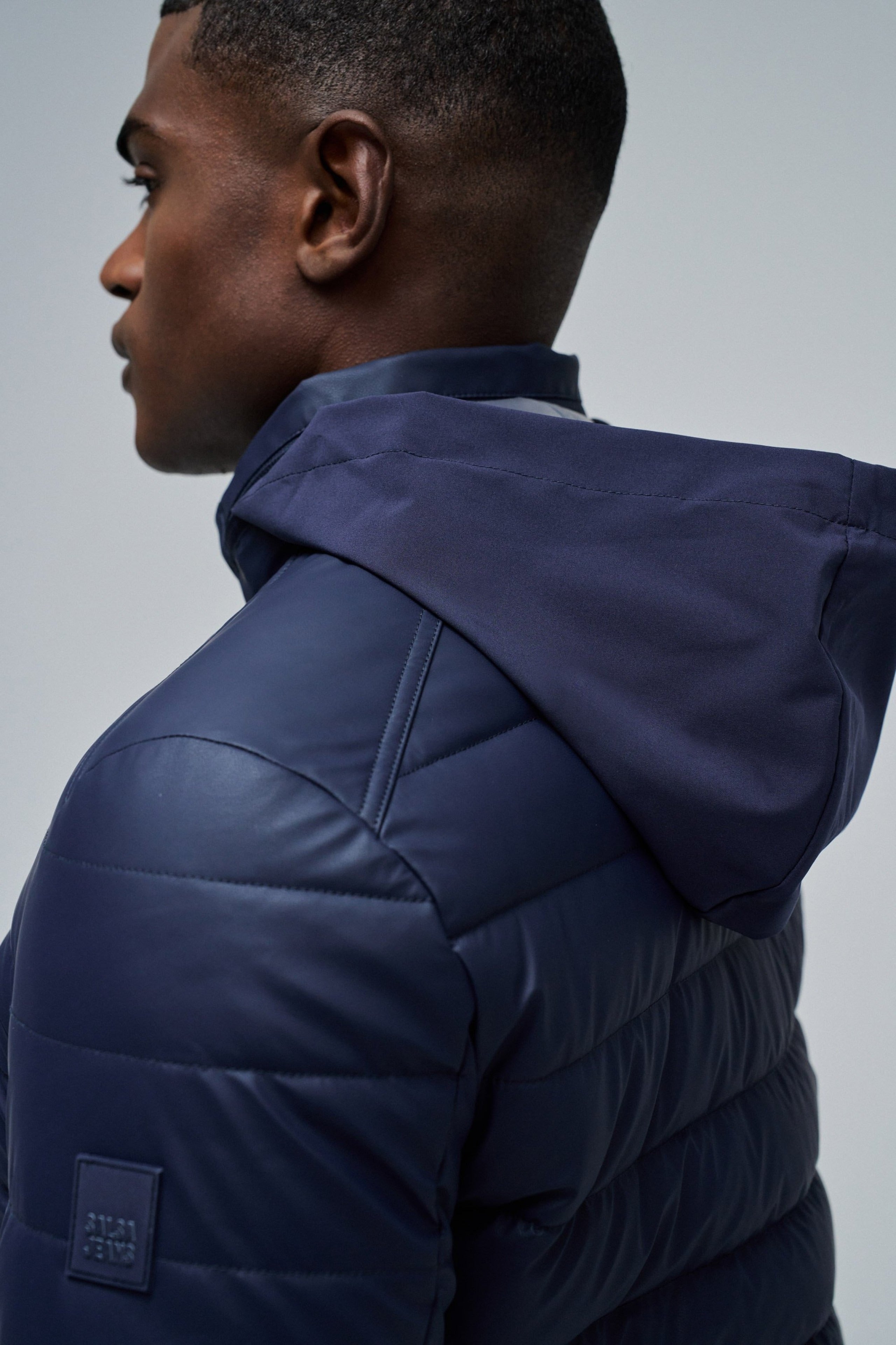 Giacca leggera imbottita in pelle PU blu scuro