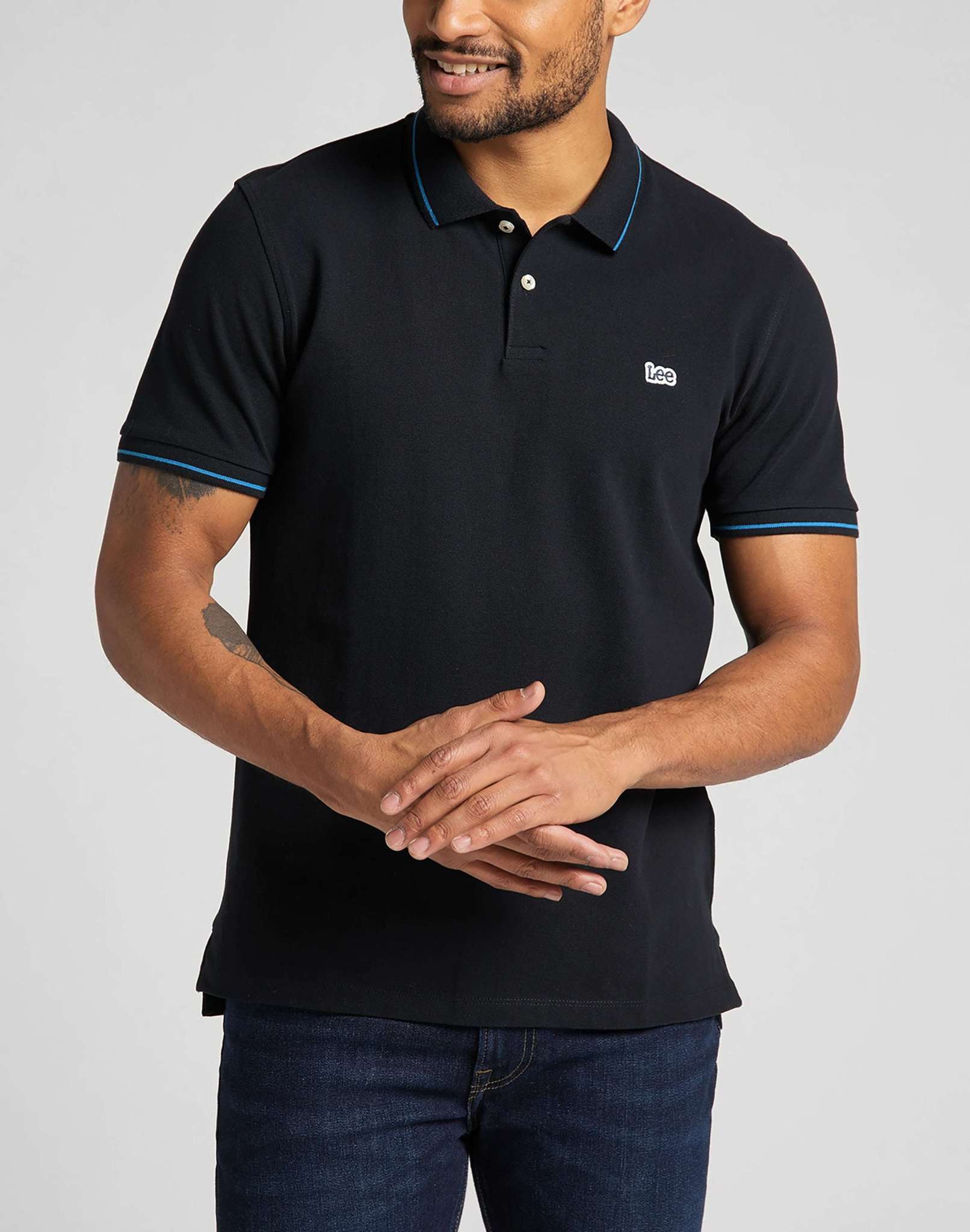 Polo in piqué di colore nero Lee