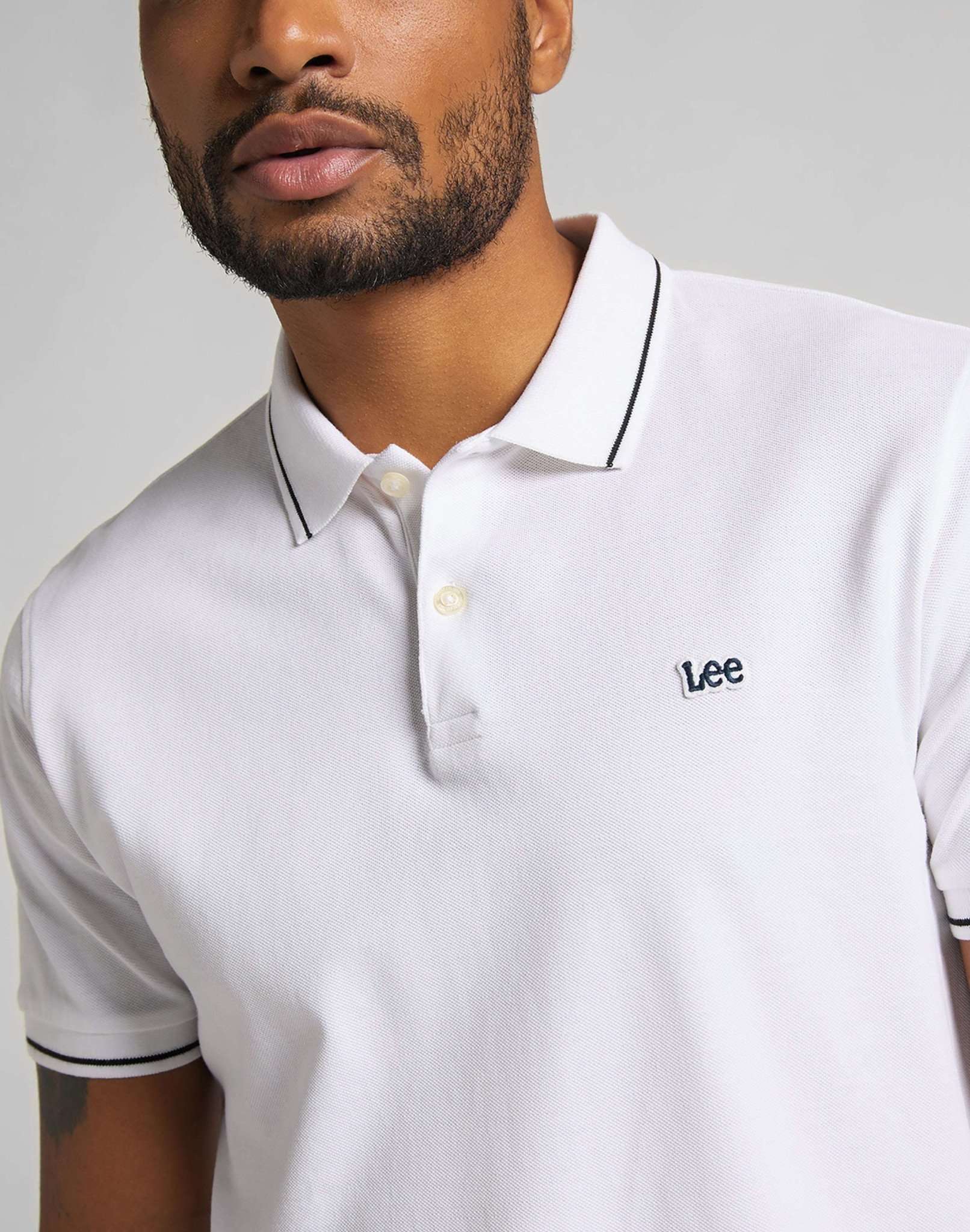Polo in piqué in bianco brillante Lee