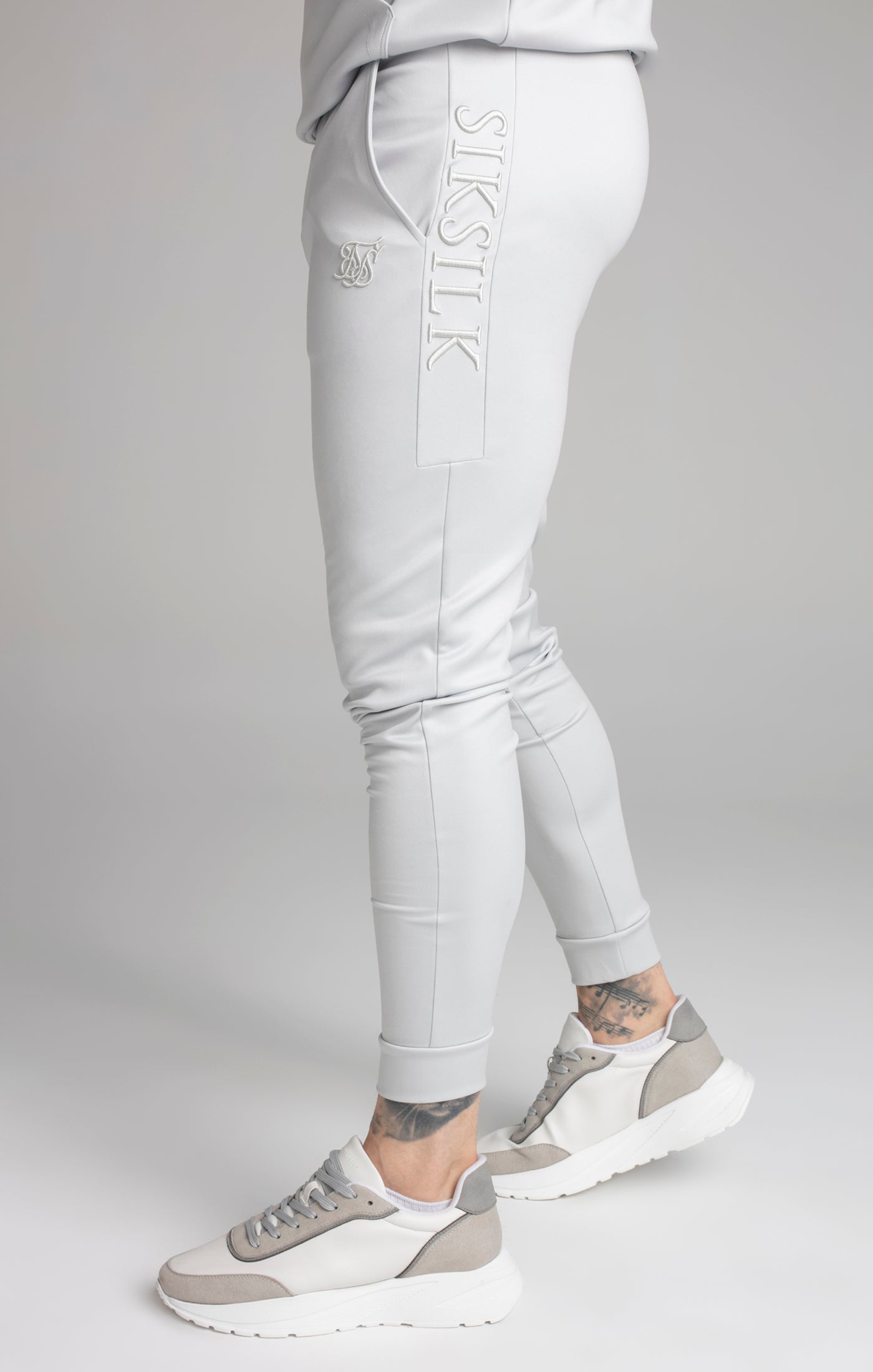 Pantalone con pannello ricamato in grigio Pantaloni SikSilk