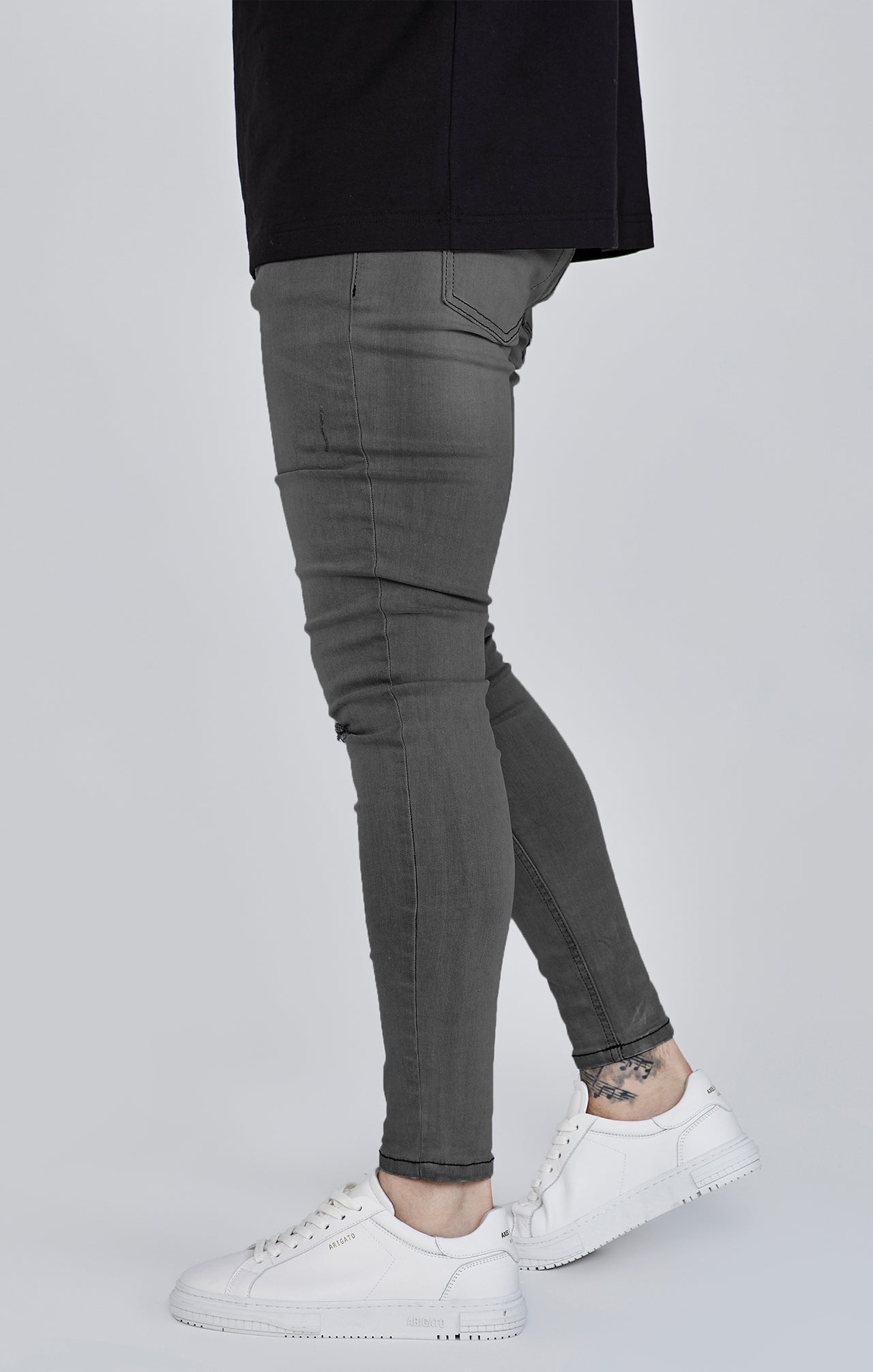 Jeans skinny invecchiati di colore grigio Jeans SikSilk