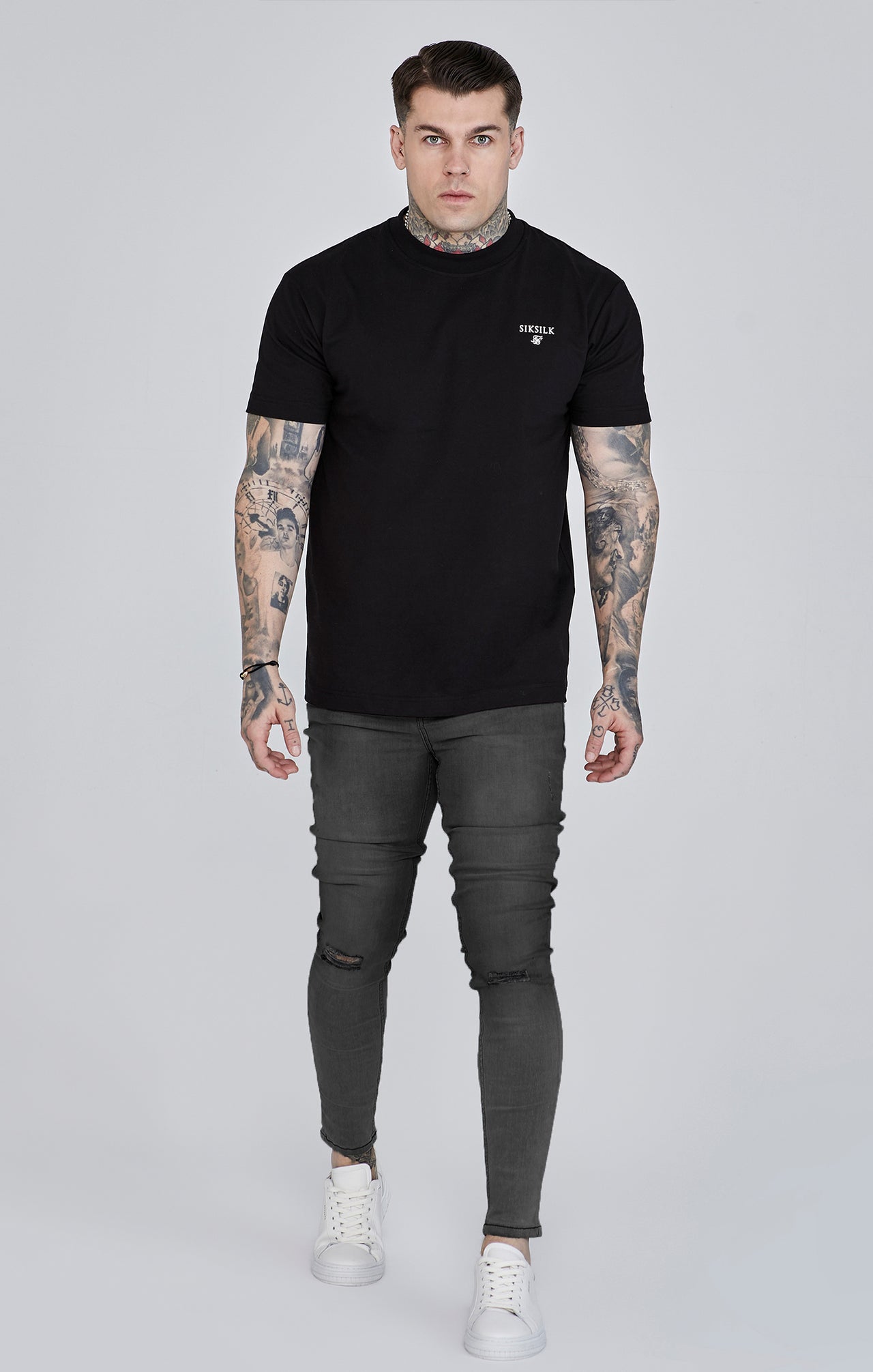 Jeans skinny invecchiati di colore grigio Jeans SikSilk