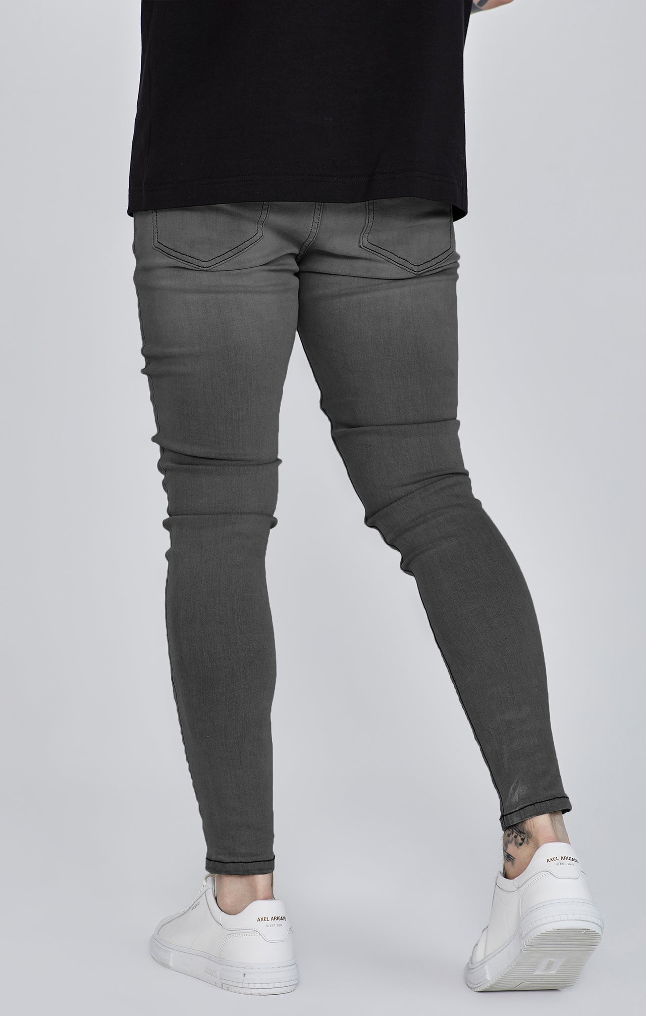Jeans skinny invecchiati di colore grigio Jeans SikSilk