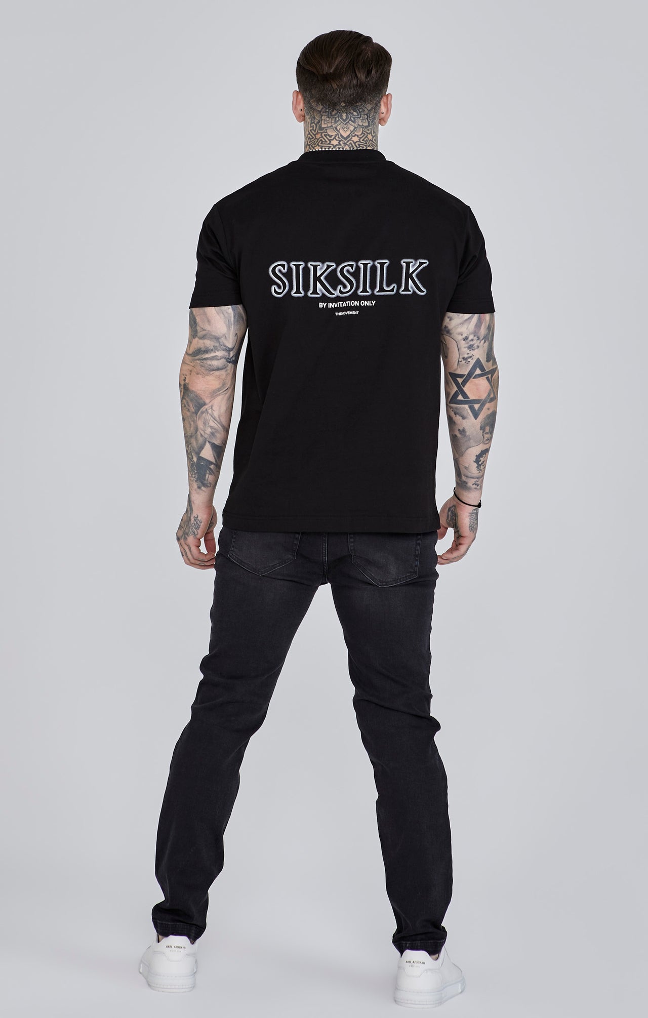 Jeans slim fit invecchiati in nero Jeans SikSilk