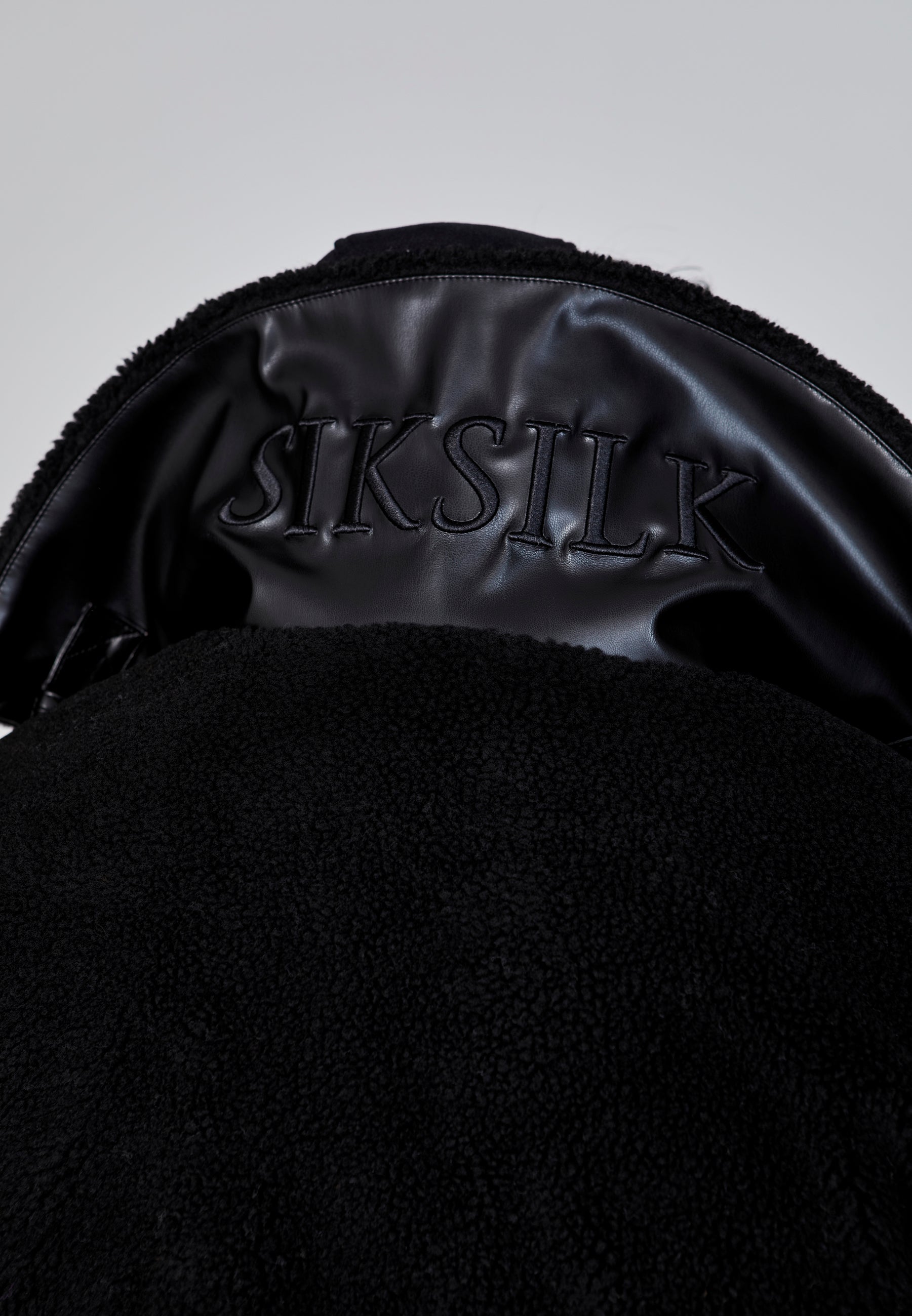 Giacca bomber Sherpa in nero Giacche SikSilk