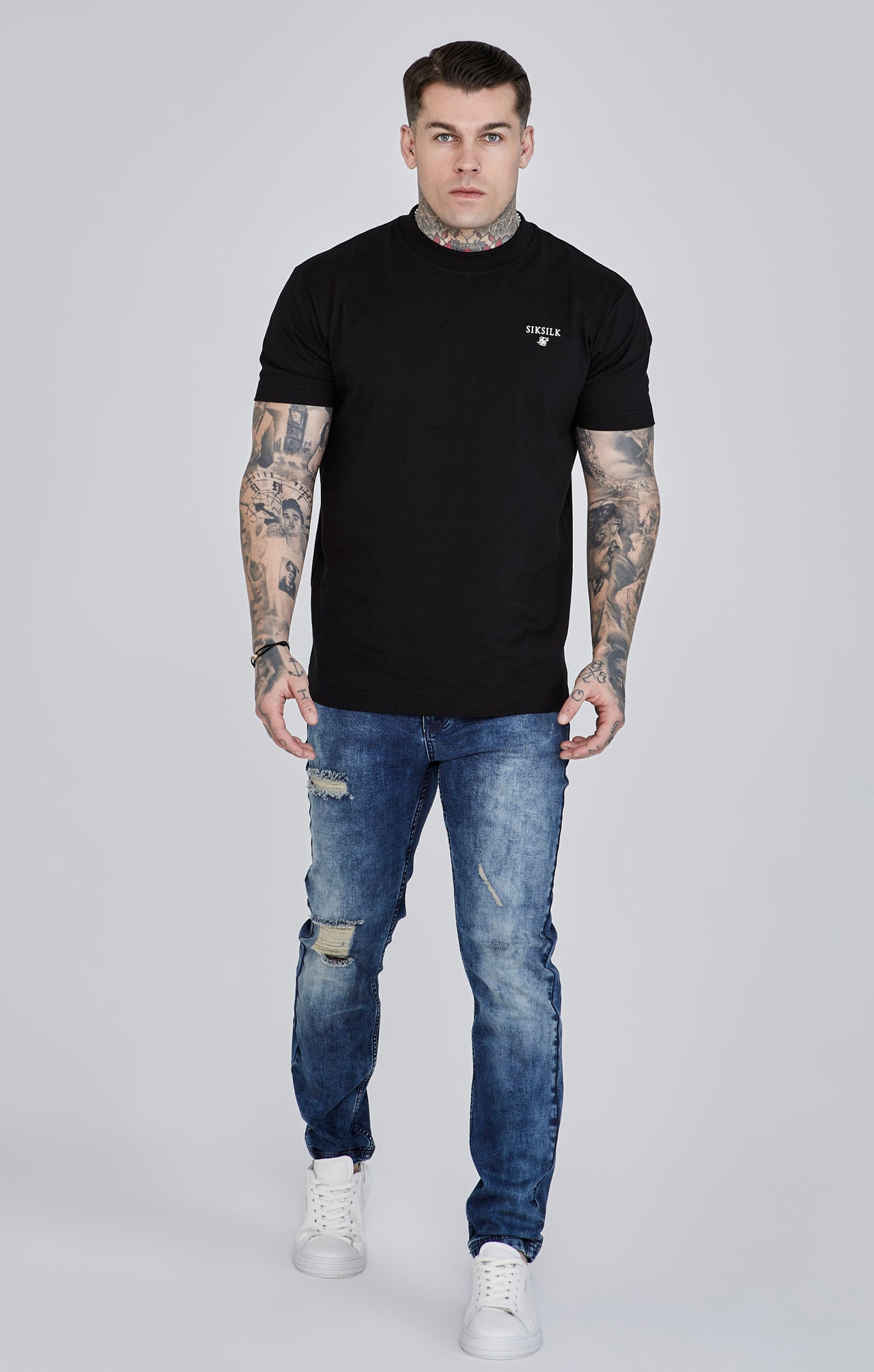 Jeans slim fit invecchiati in blu SikSilk
