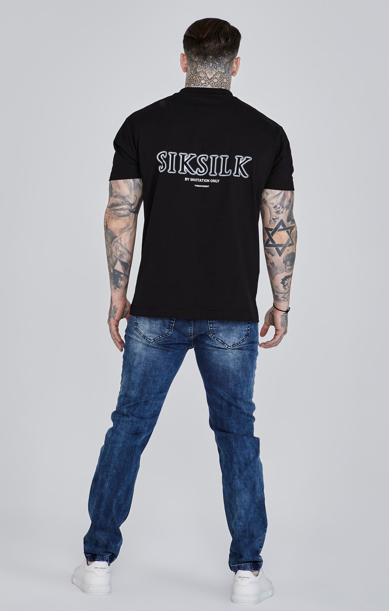 Jeans slim fit invecchiati in blu SikSilk