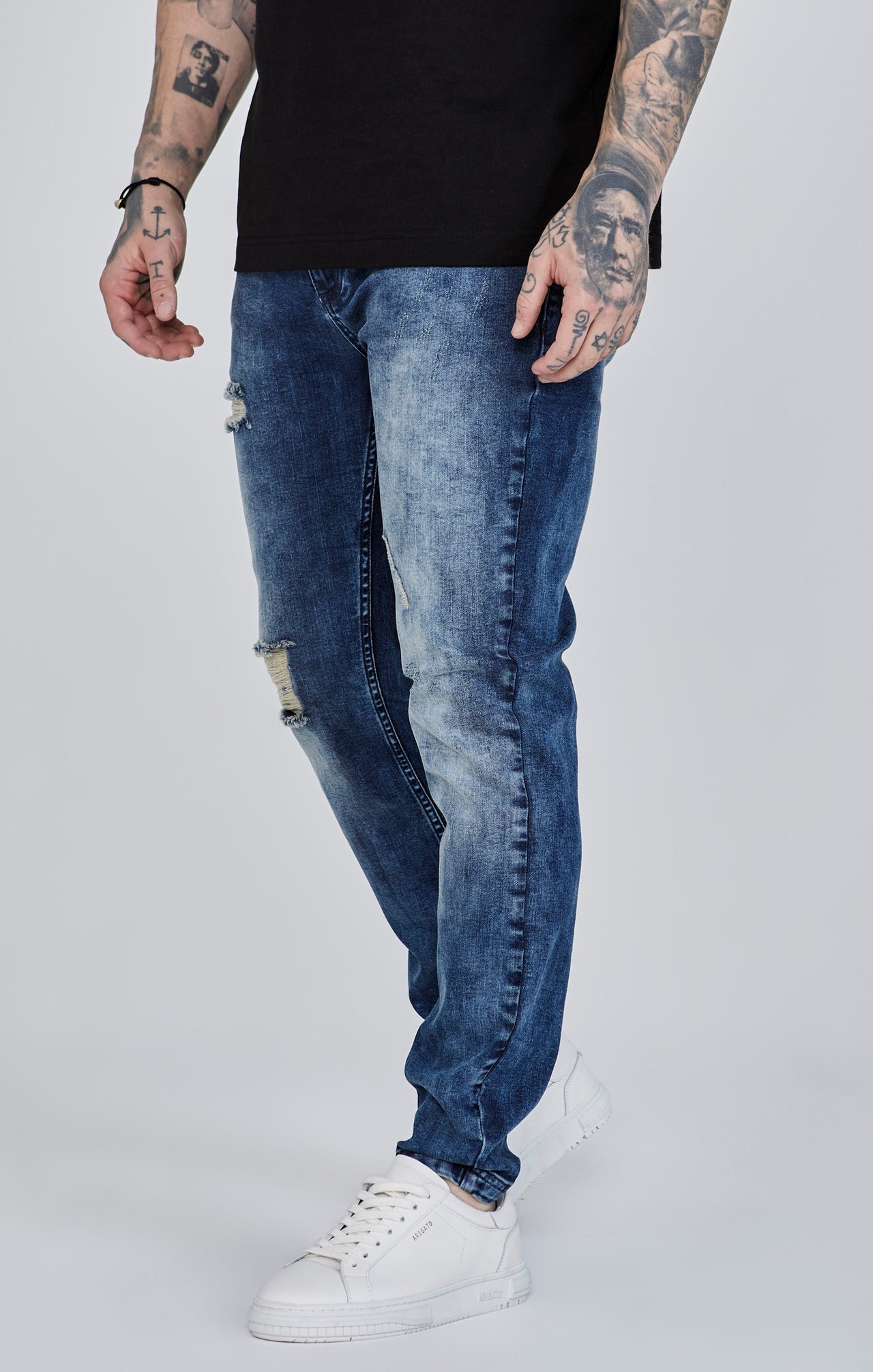 Jeans slim fit invecchiati in blu SikSilk