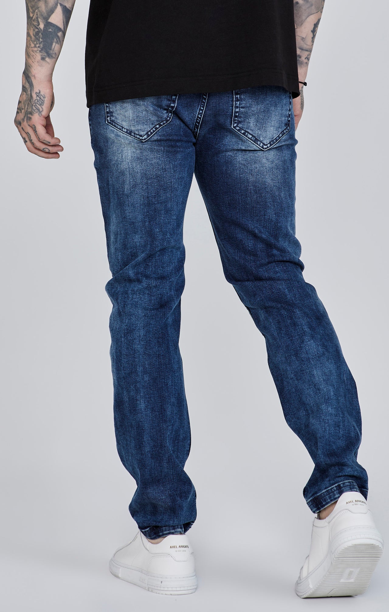 Jeans slim fit invecchiati in blu SikSilk