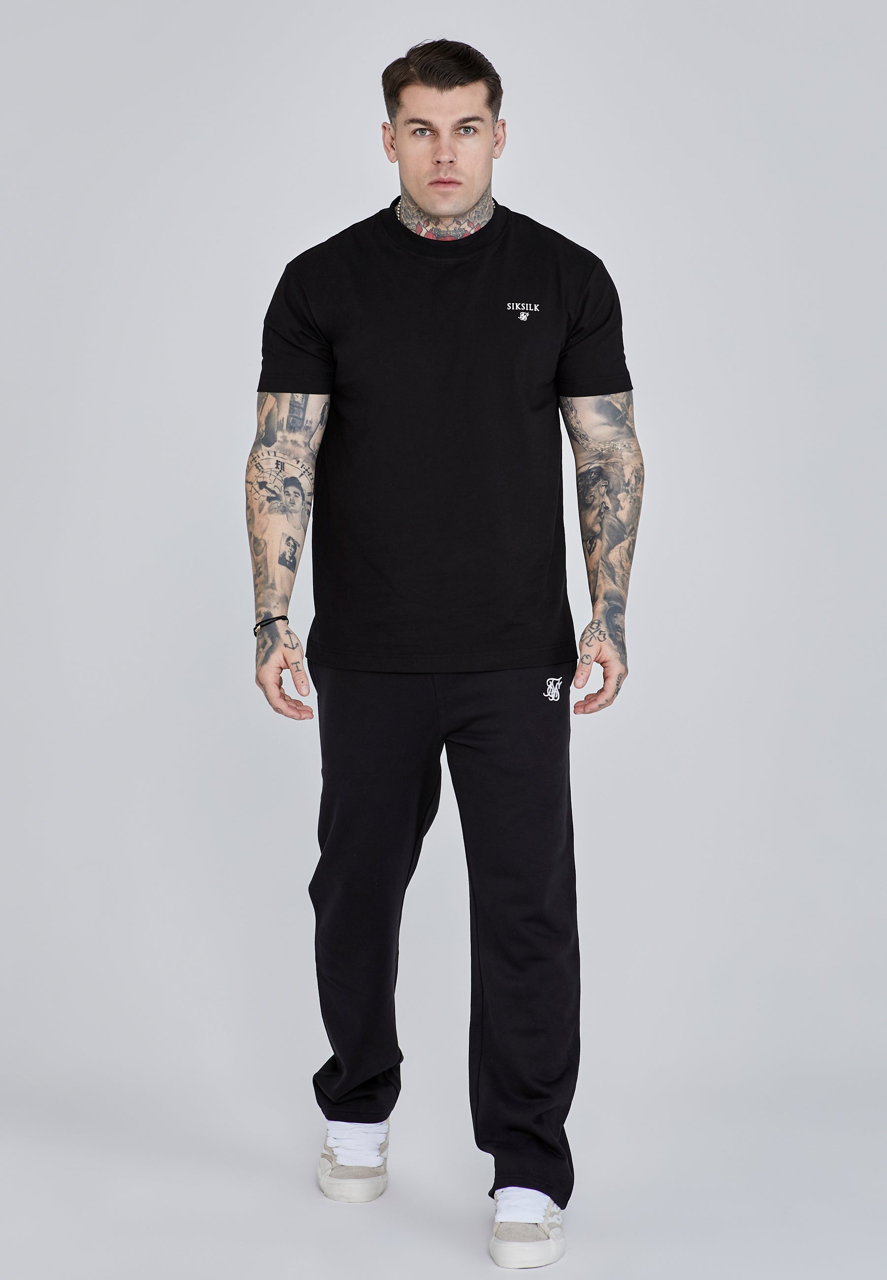 Pantaloni da corsa in nero Pantaloni SikSilk