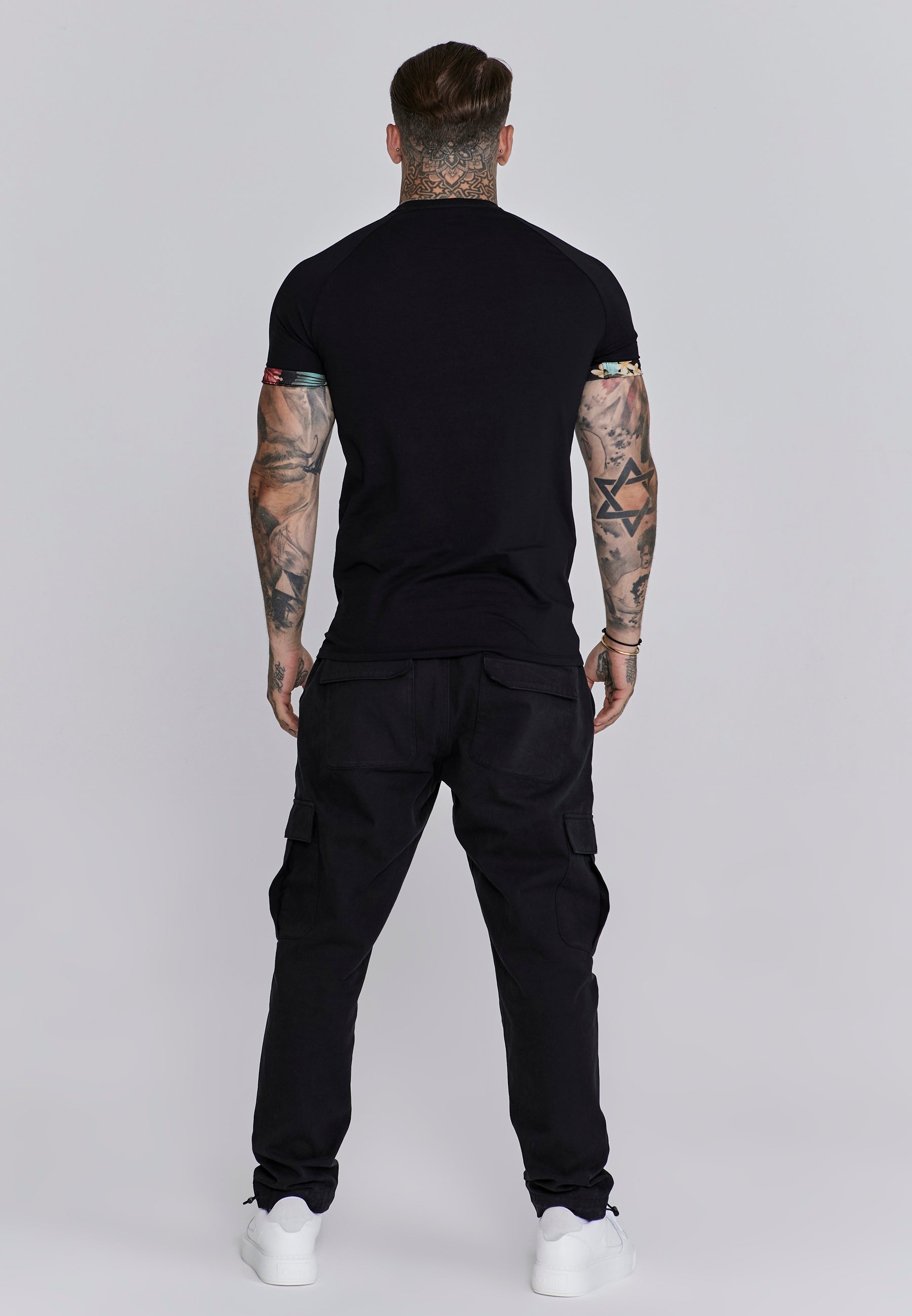 Maglietta con maniche a rotolo in nero Magliette SikSilk