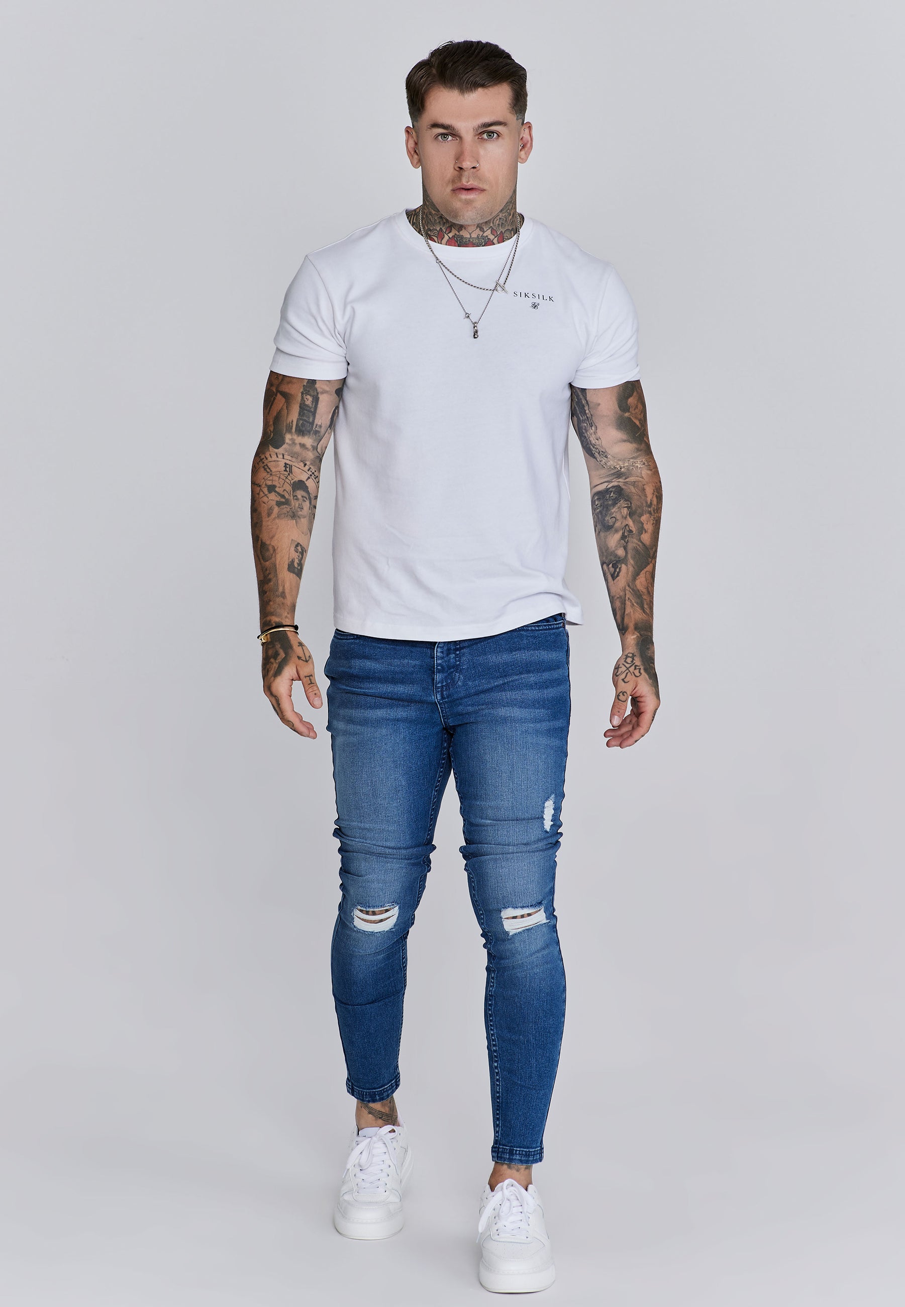 Jeans skinny invecchiati in jeans blu SikSilk