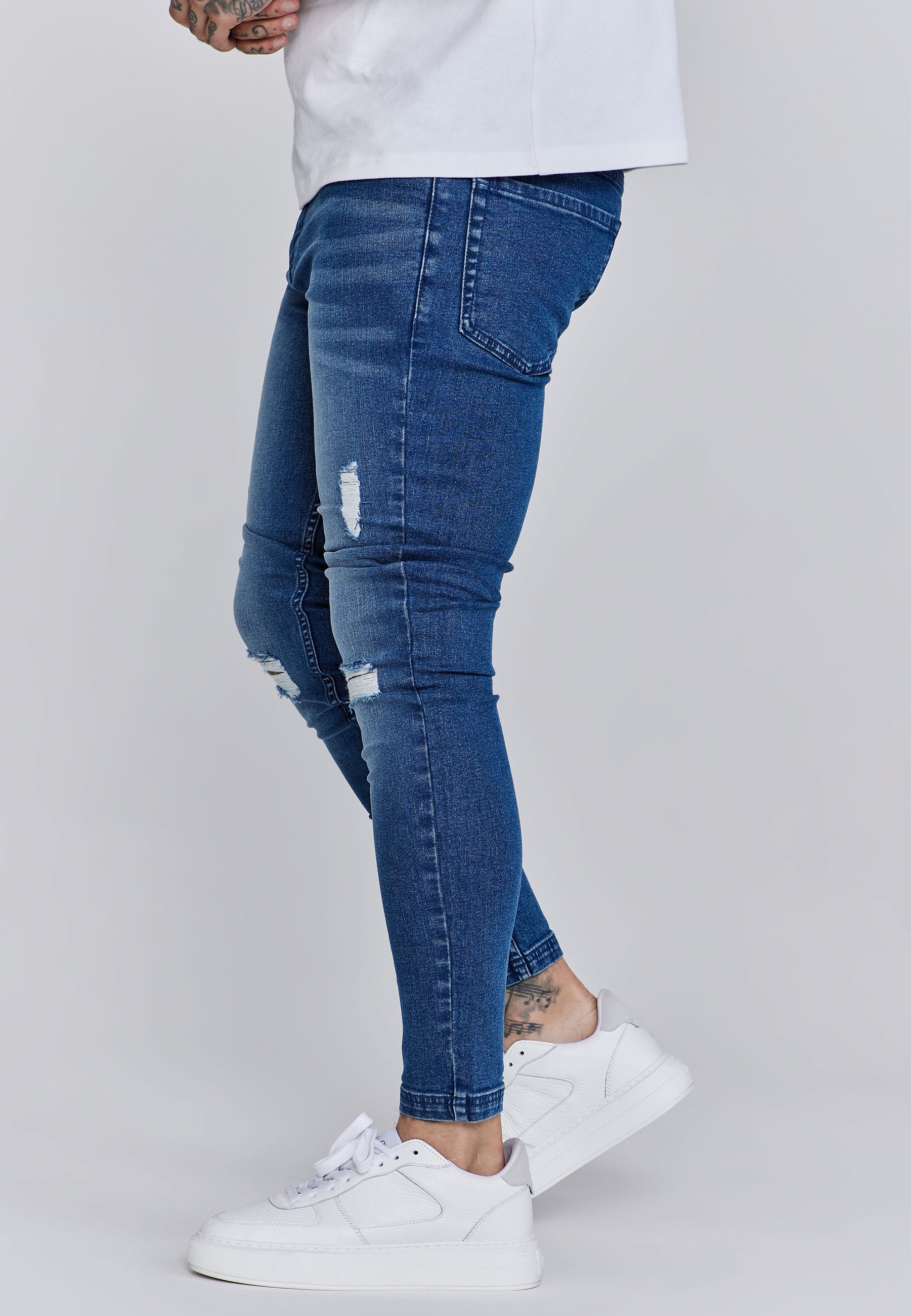 Jeans skinny invecchiati in jeans blu SikSilk