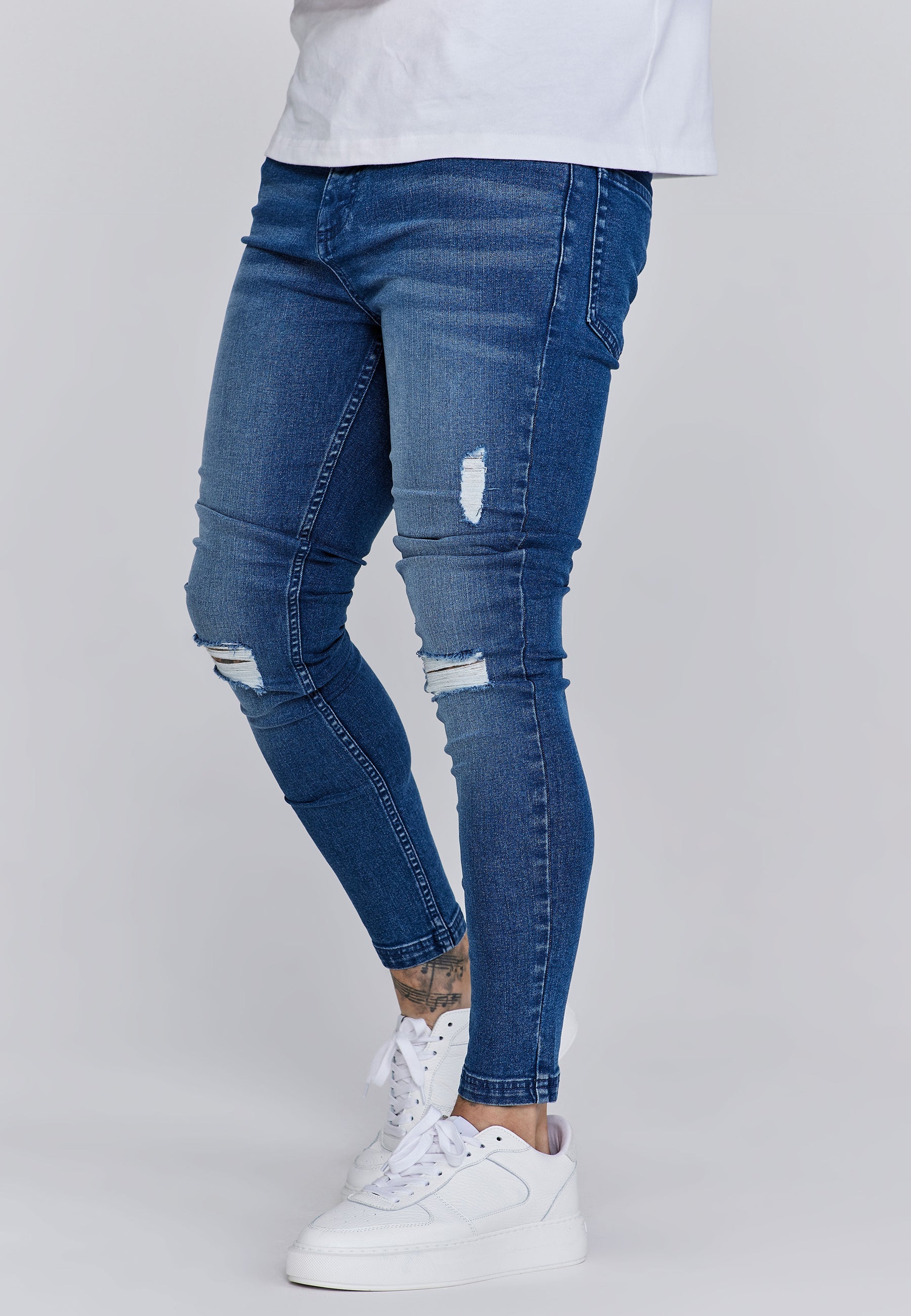 Jeans skinny invecchiati in jeans blu SikSilk