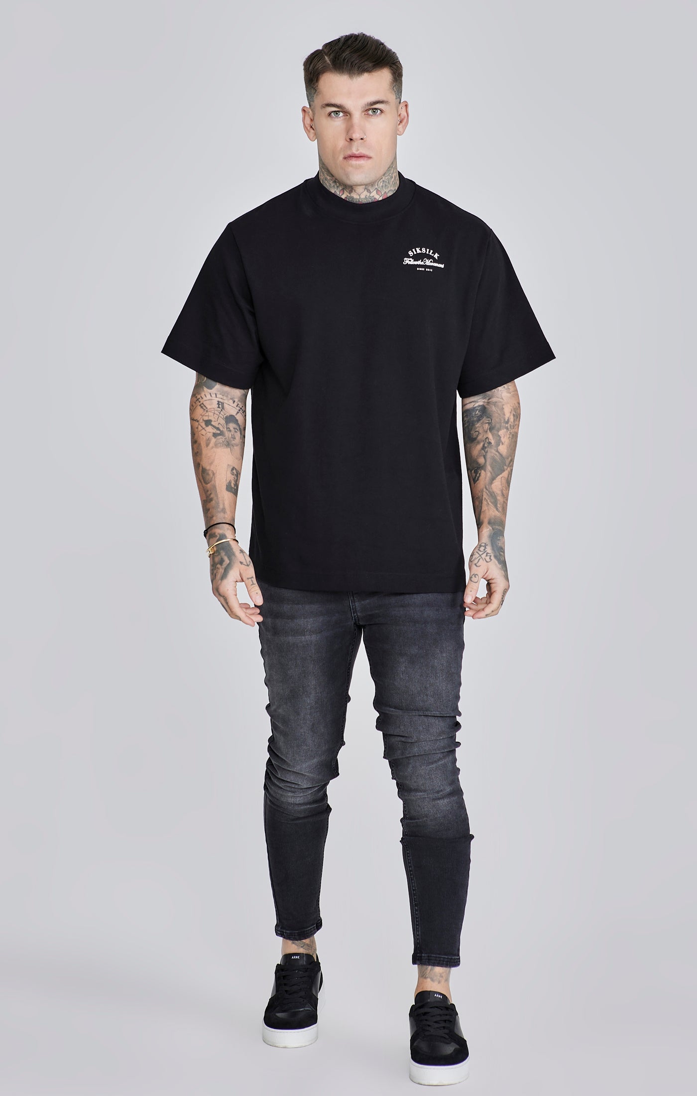 Jeans skinny in nero lavato SikSilk