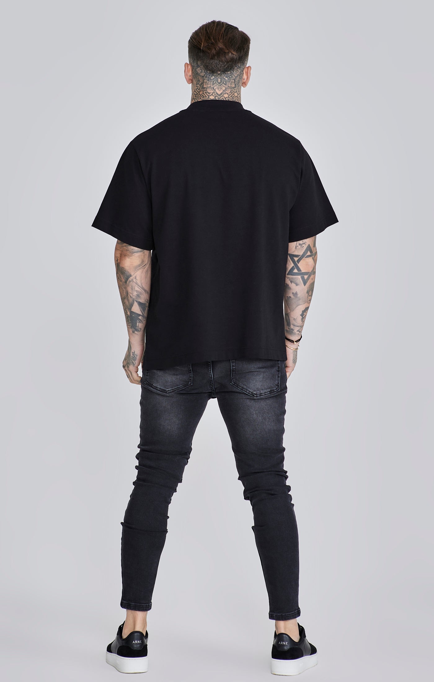 Jeans skinny in nero lavato SikSilk