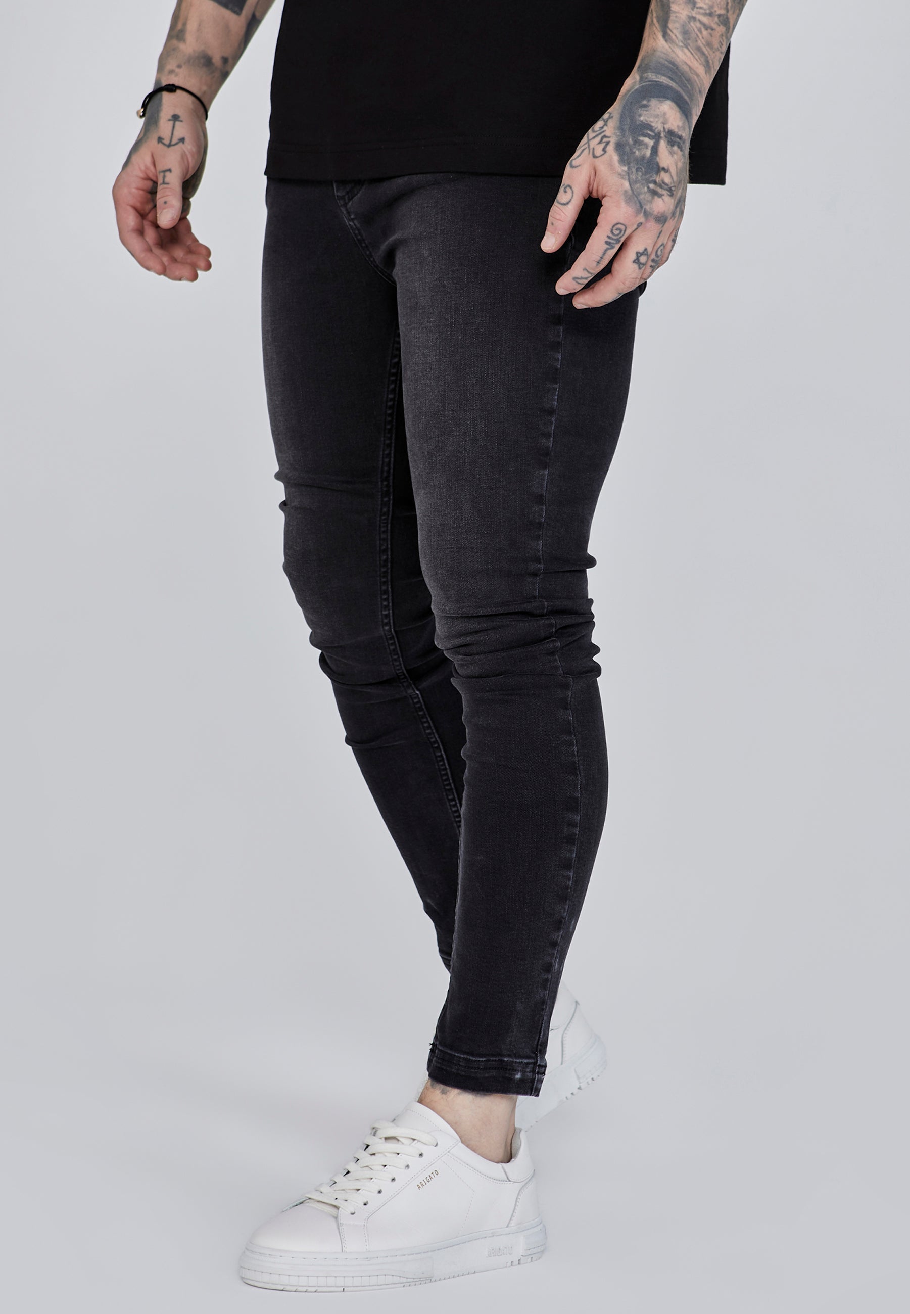 Jeans skinny in nero lavato SikSilk