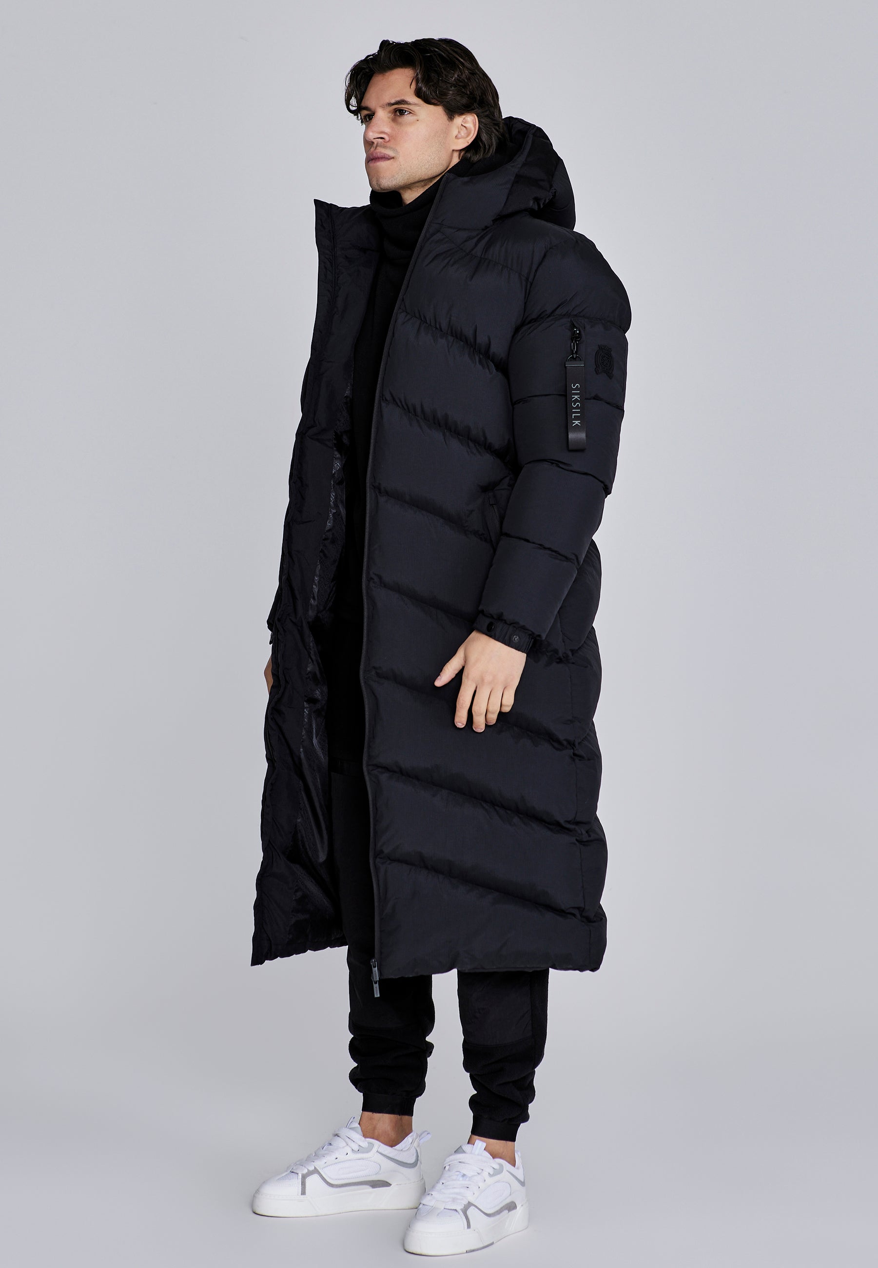 Puffer lungo in nero Giacche SikSilk
