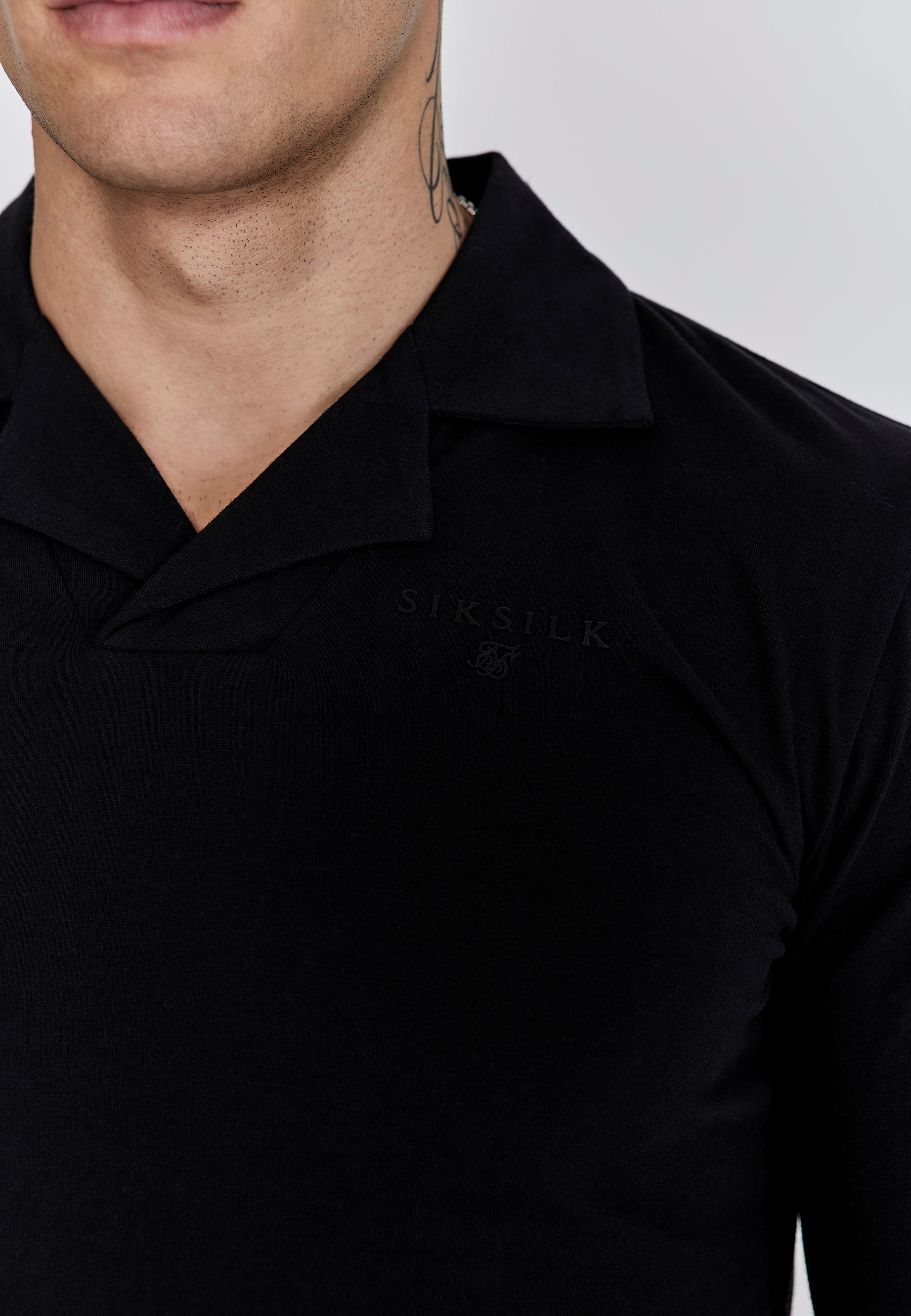 Polo Smart Revere a maniche lunghe in nero Polo SikSilk
