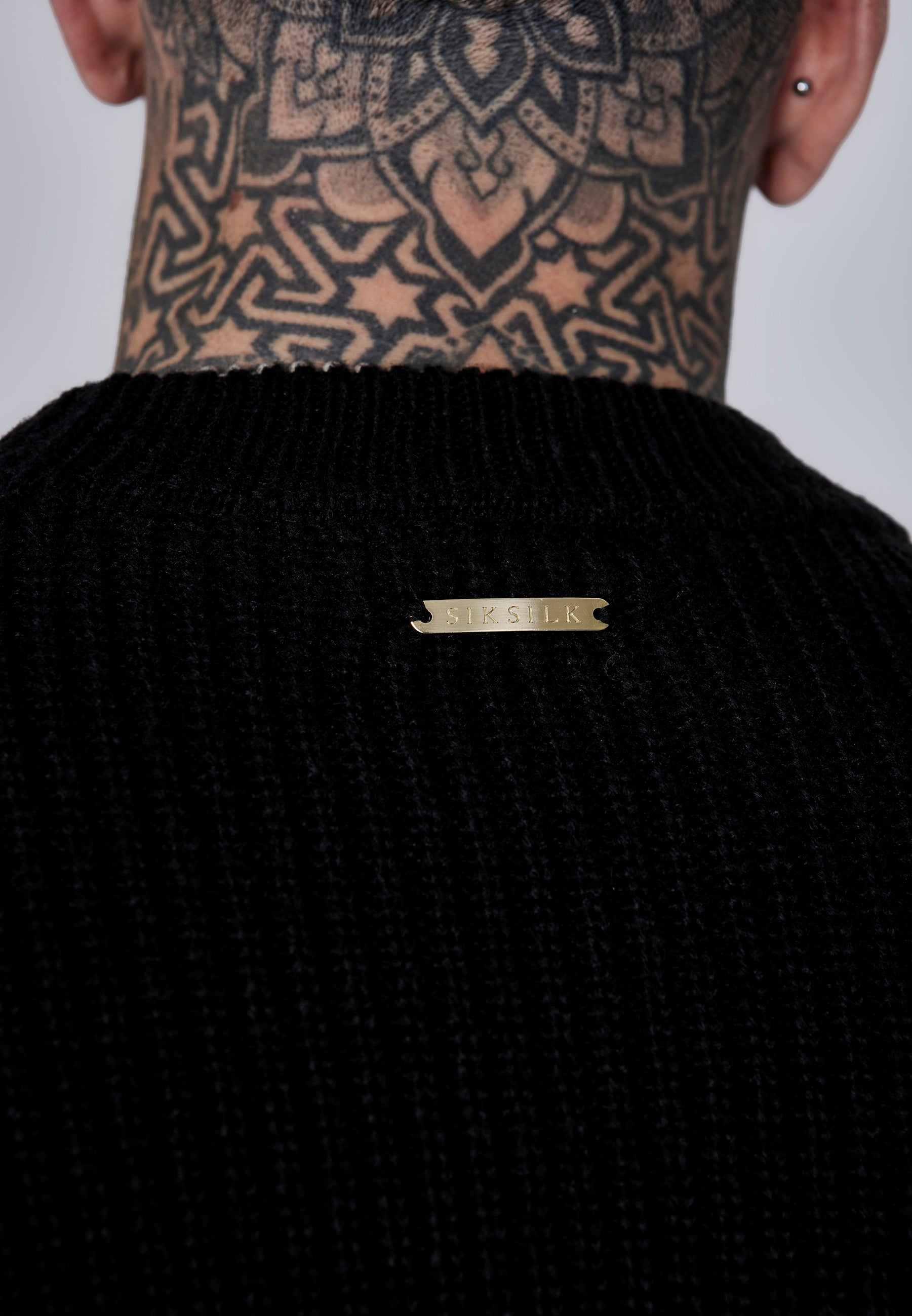 Maglione lavorato a maglia in nero Maglioni SikSilk