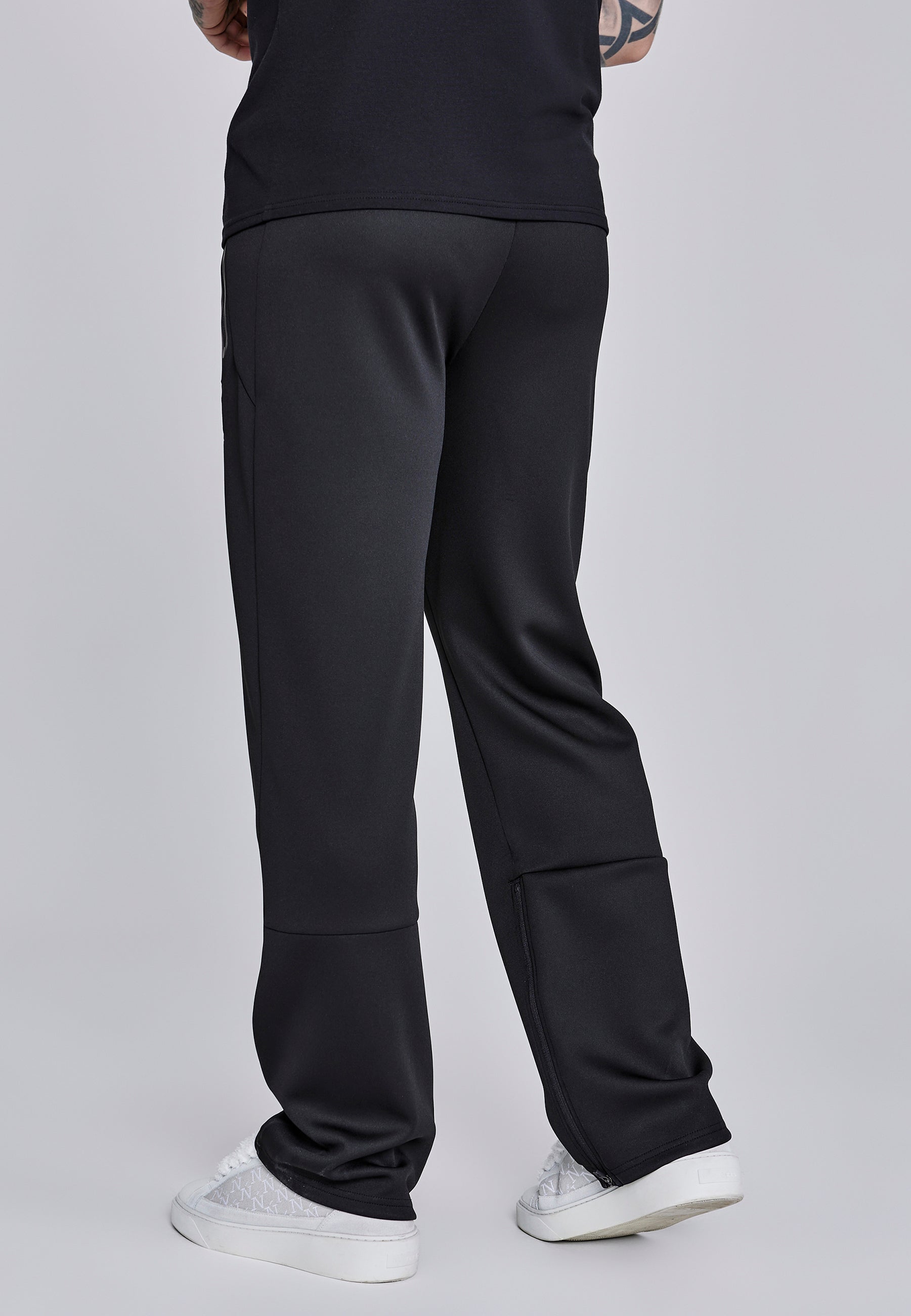 Pantaloni da corsa in nero Pantaloni SikSilk