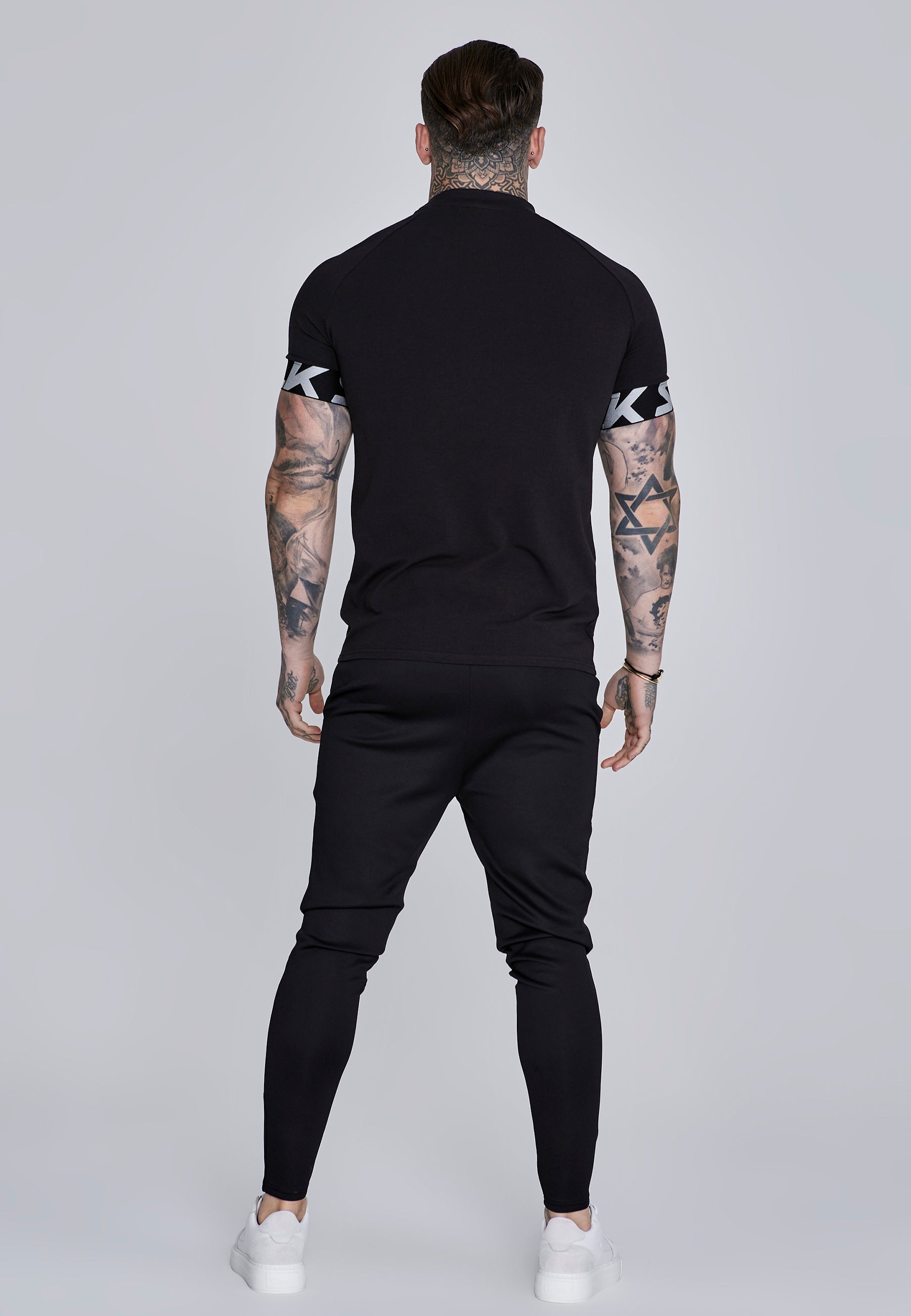 Joggers Essentials in poliestere nero Pantaloni SikSilk