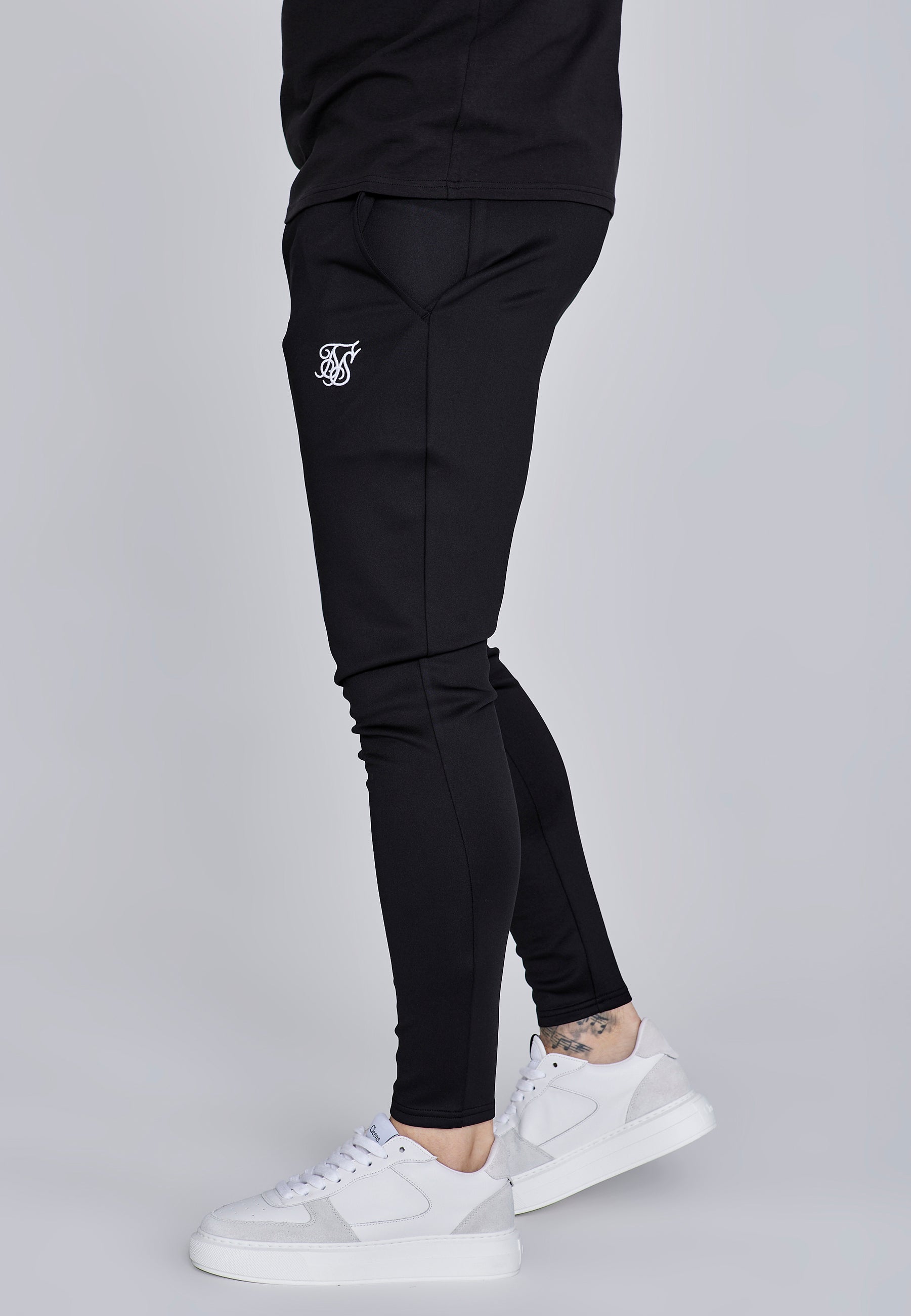 Joggers Essentials in poliestere nero Pantaloni SikSilk