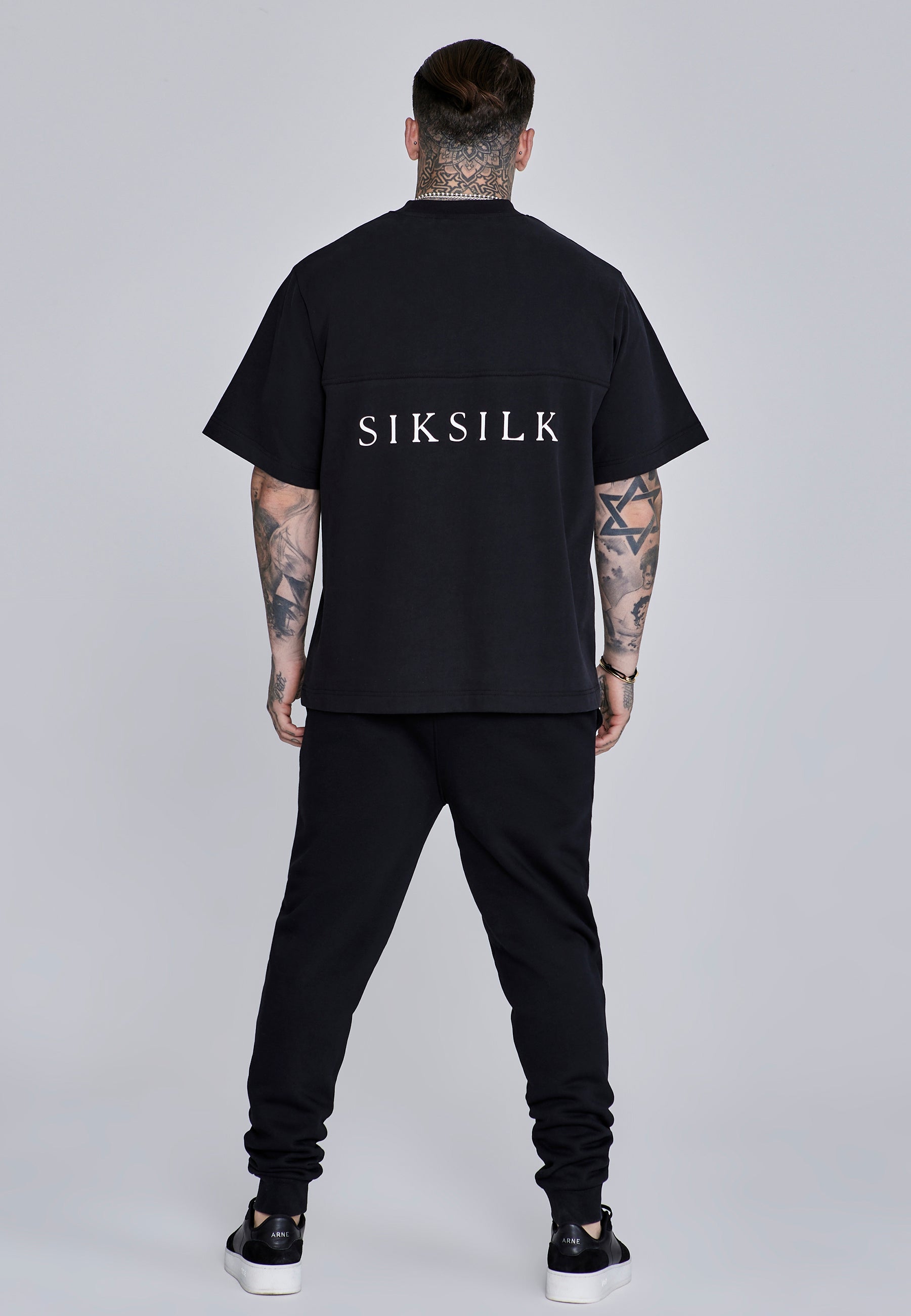 Joggers essenziali in nero Pantaloni SikSilk