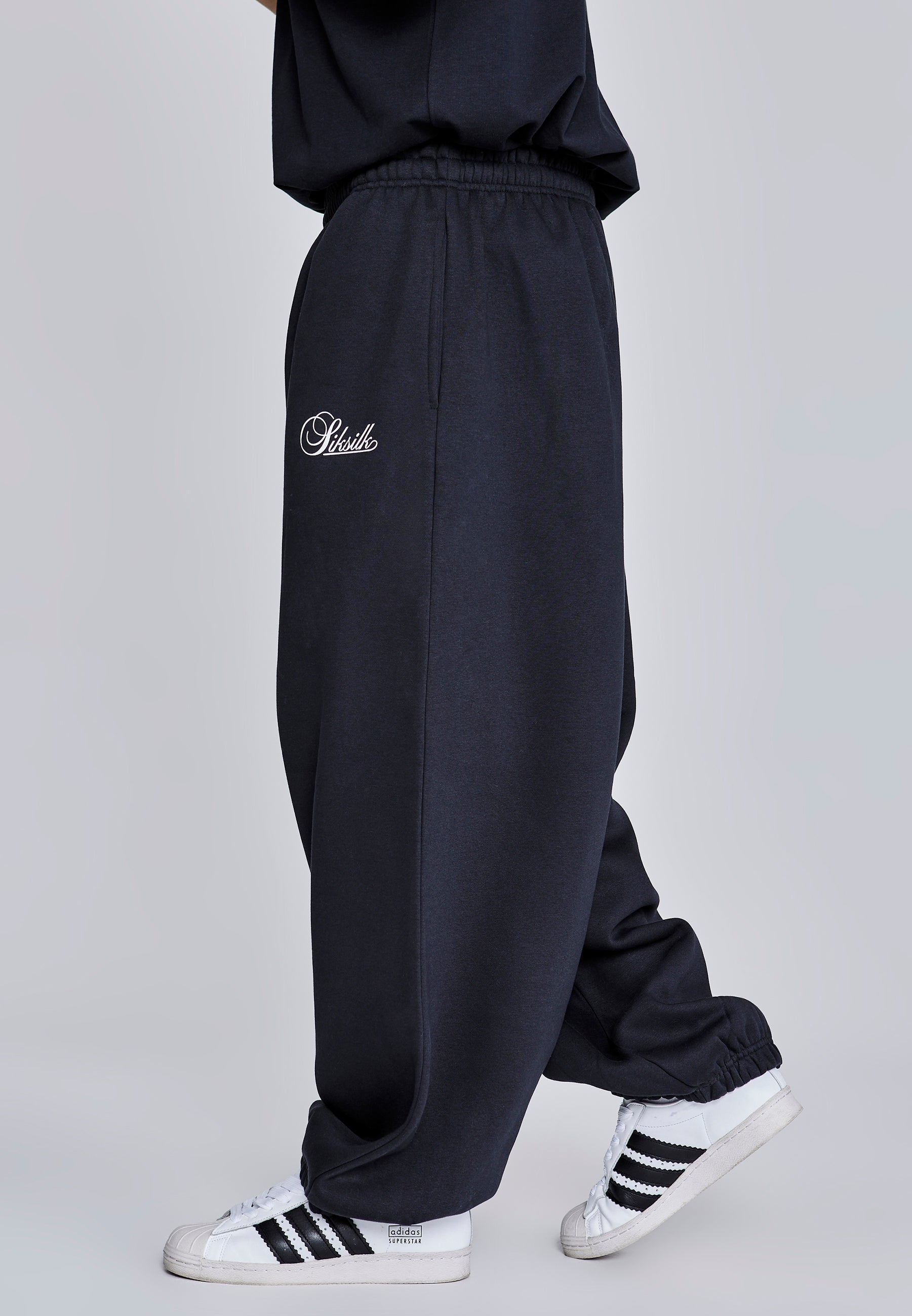 Joggers essenziali in nero Pantaloni SikSilk