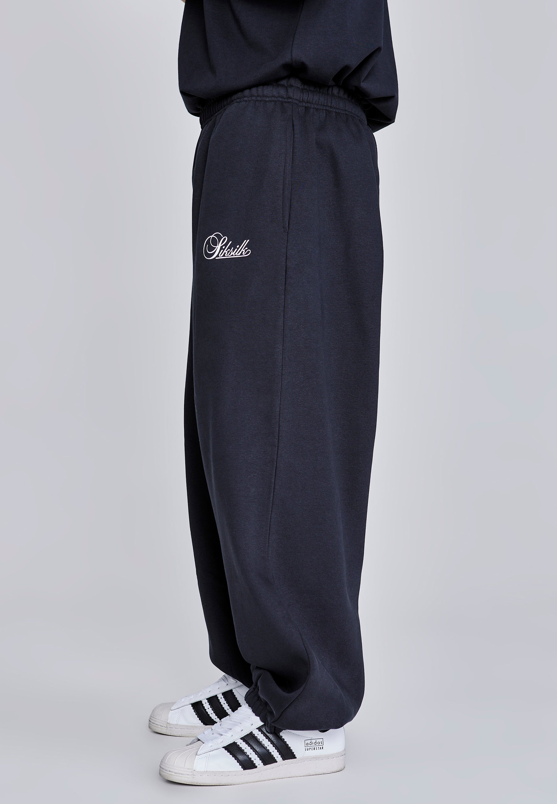Joggers essenziali in nero Pantaloni SikSilk