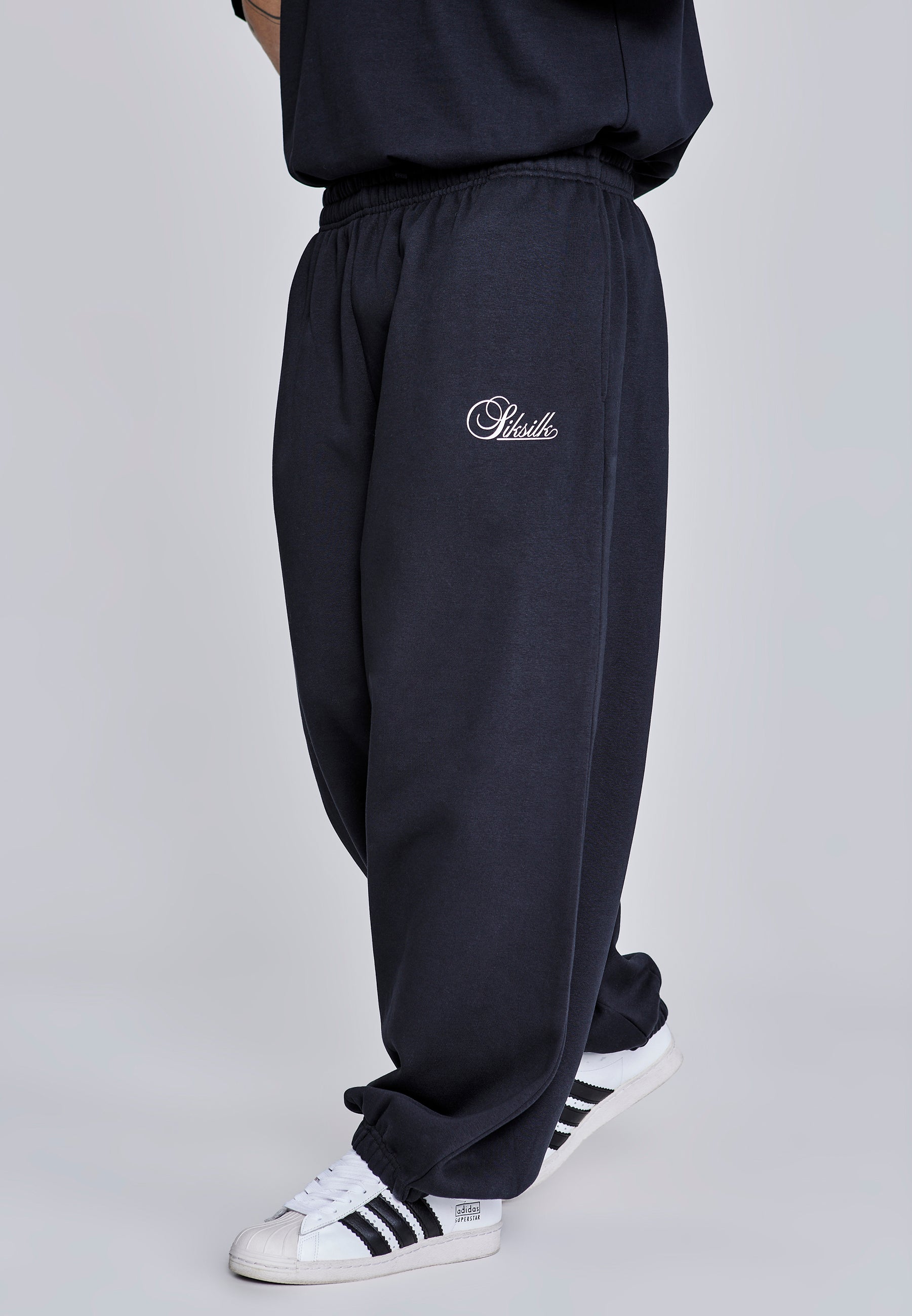 Joggers essenziali in nero Pantaloni SikSilk