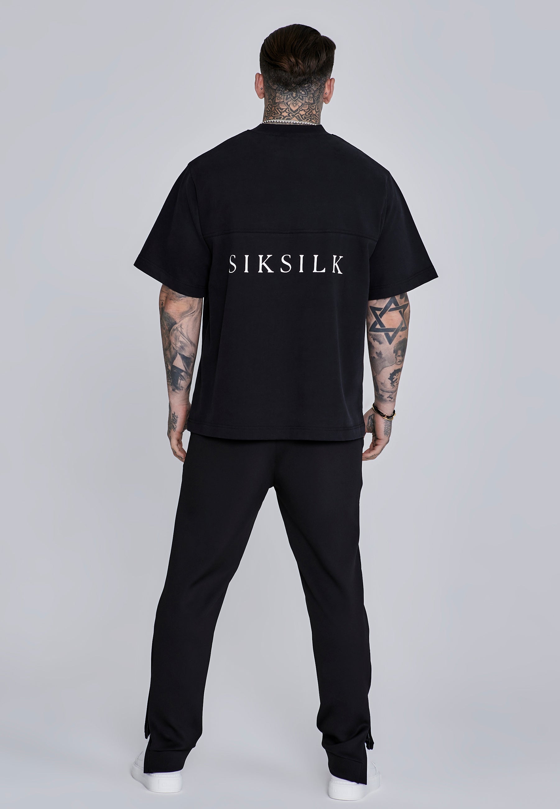 Joggers Essentials in poliestere nero Pantaloni SikSilk