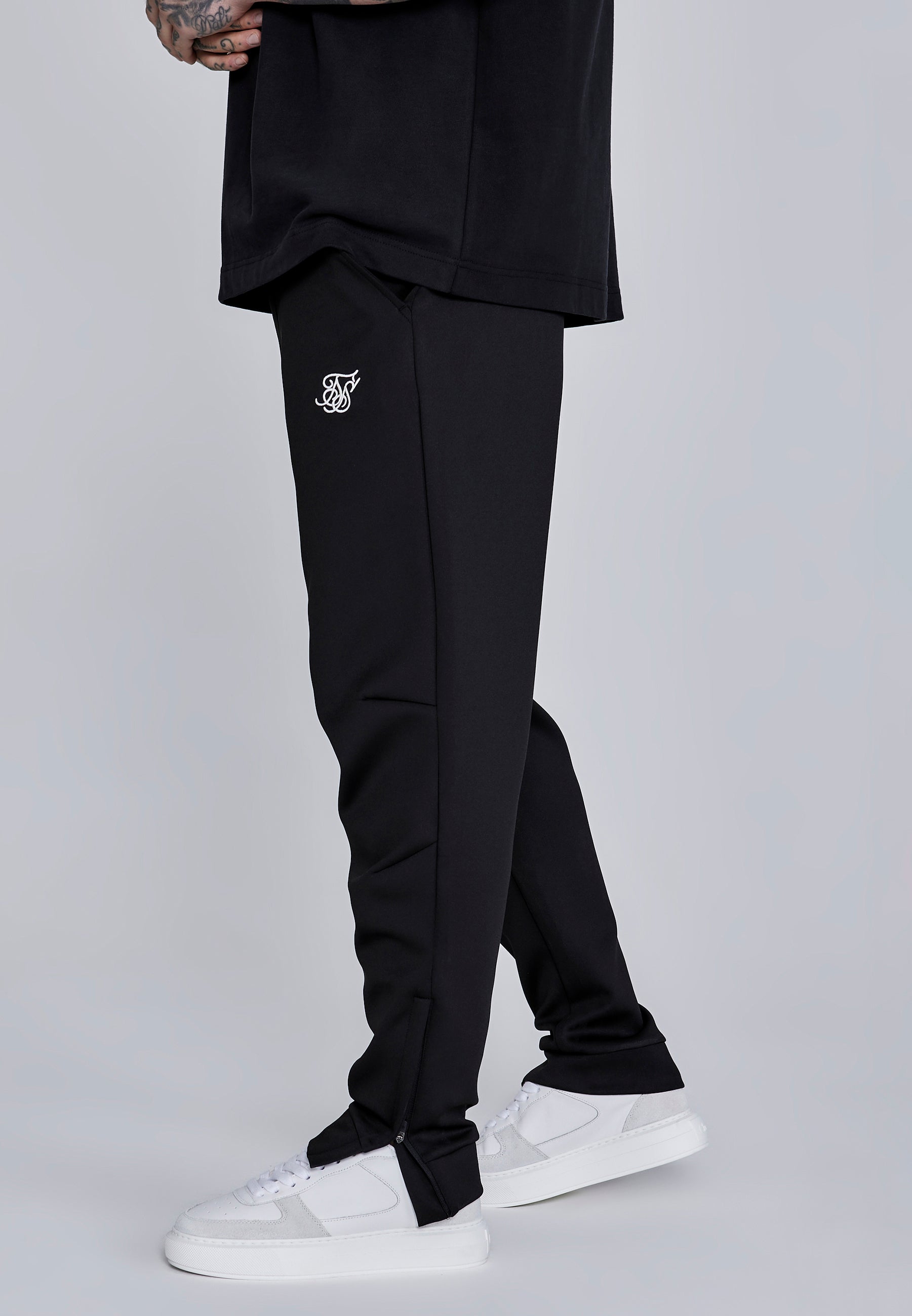 Joggers Essentials in poliestere nero Pantaloni SikSilk