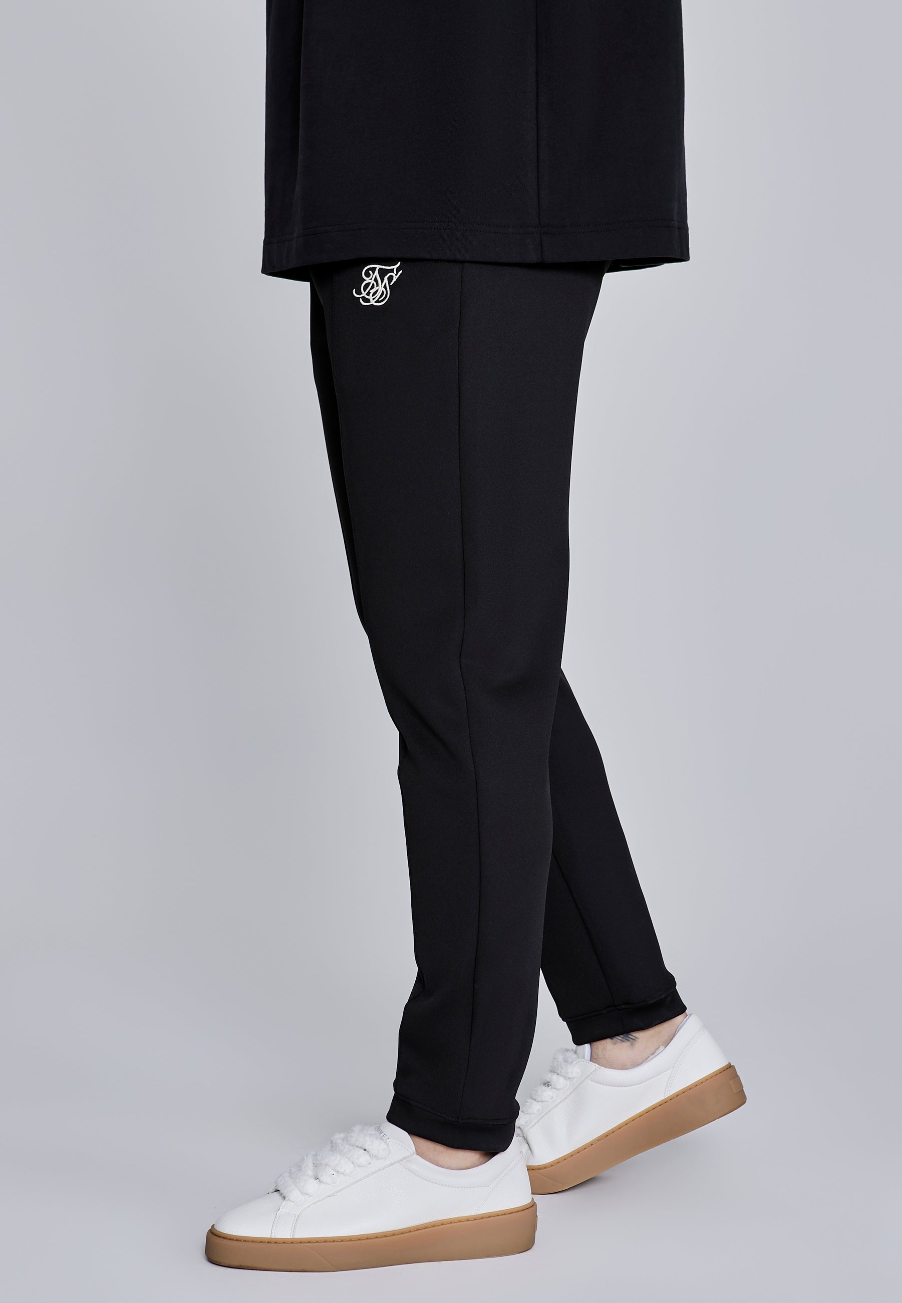 Pantaloni Essentials a pieghe in nero Pantaloni SikSilk