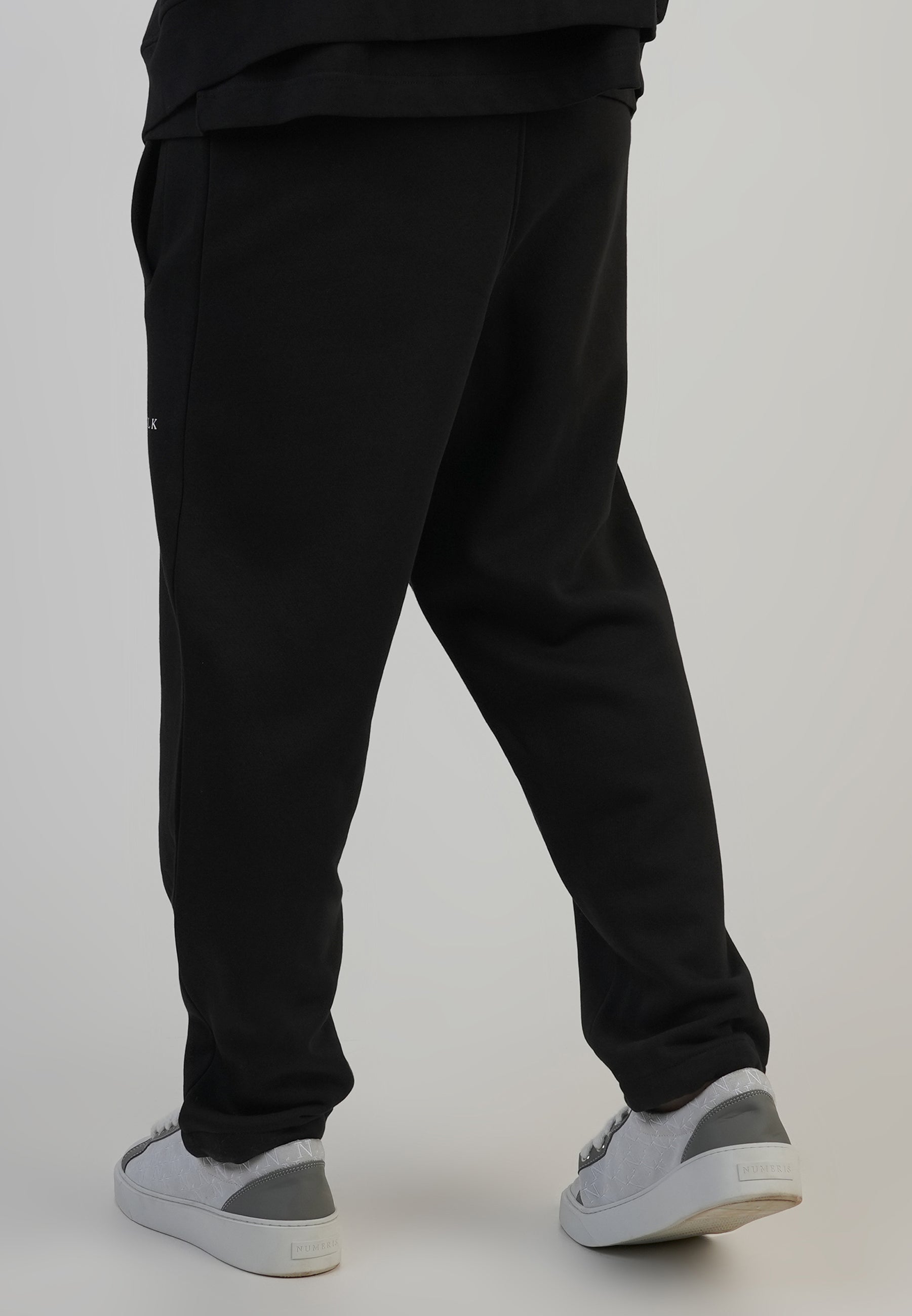 Pantaloni da corsa in nero Pantaloni SikSilk