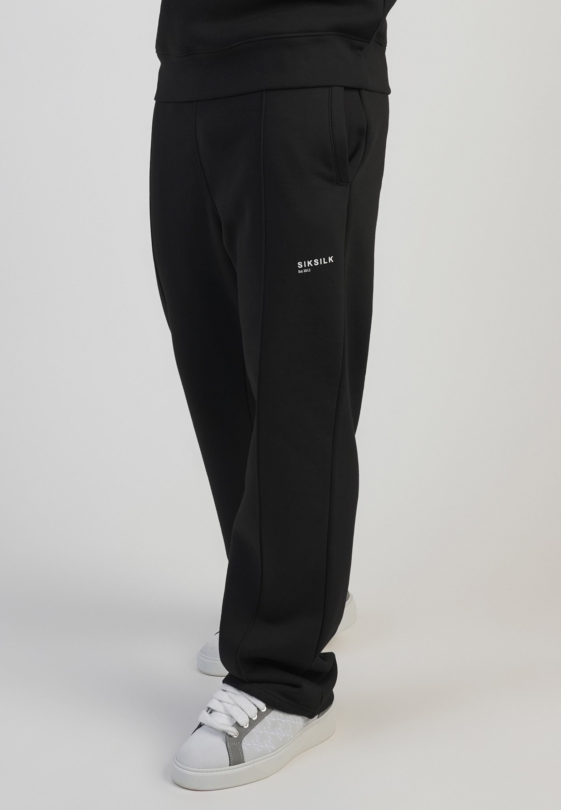 Pantaloni da corsa in nero Pantaloni SikSilk