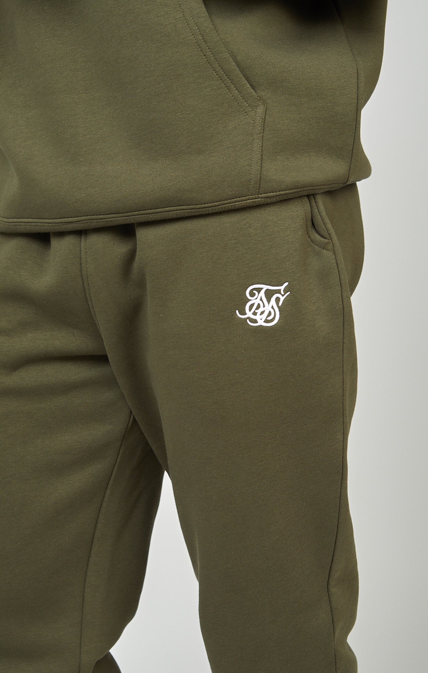 Jogger essenziale con risvolto in pantaloni color kaki SikSilk   