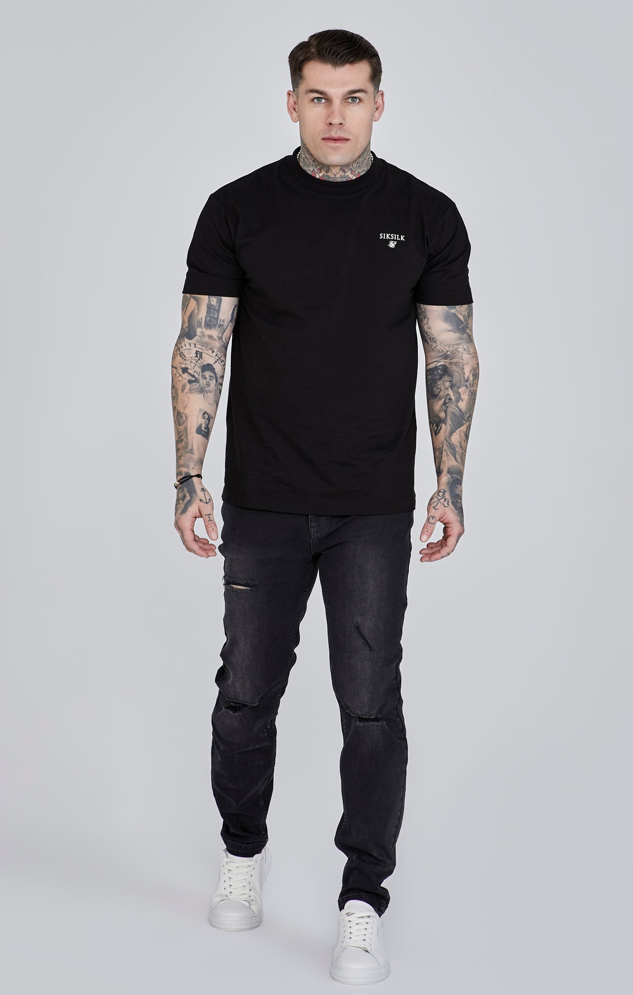 Jeans slim fit invecchiati in nero Jeans SikSilk   