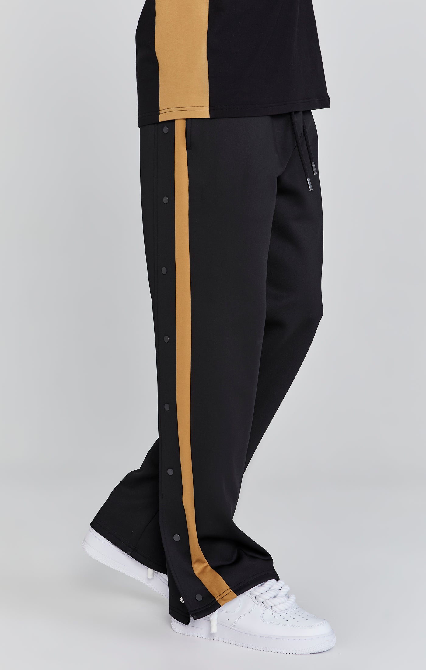 Pantaloni da corsa in nero Pantaloni SikSilk   