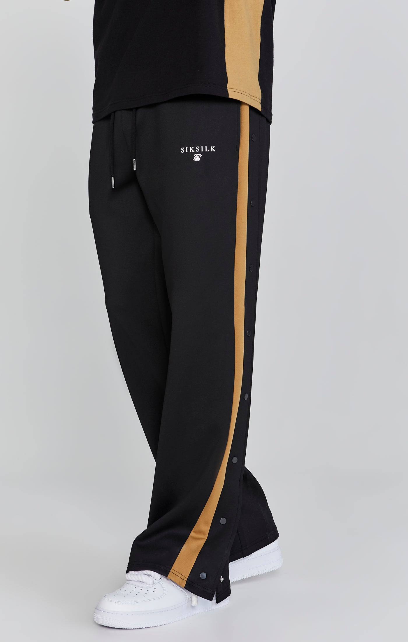 Pantaloni da corsa in nero Pantaloni SikSilk   