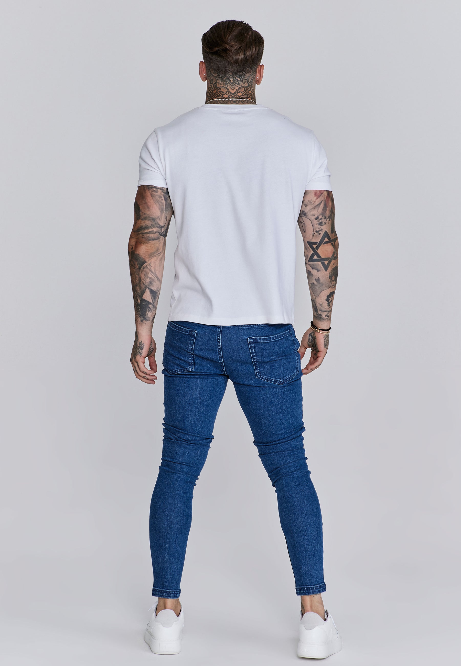 Jeans skinny invecchiati in jeans blu SikSilk