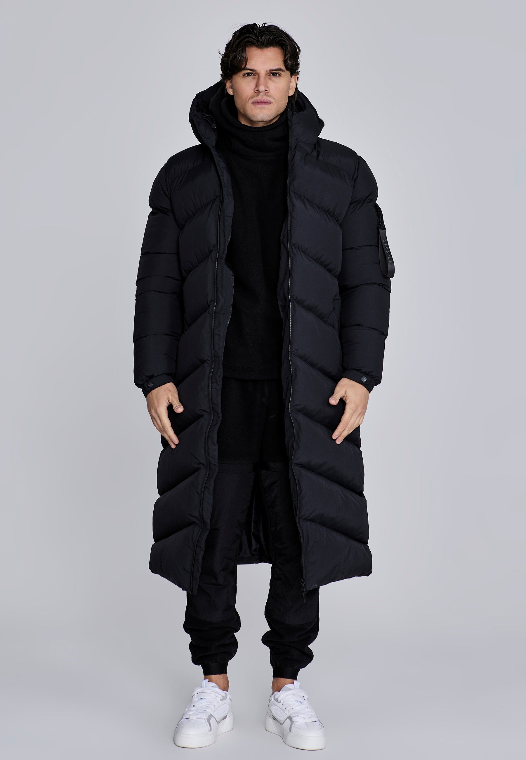 Puffer lungo in nero Giacche SikSilk