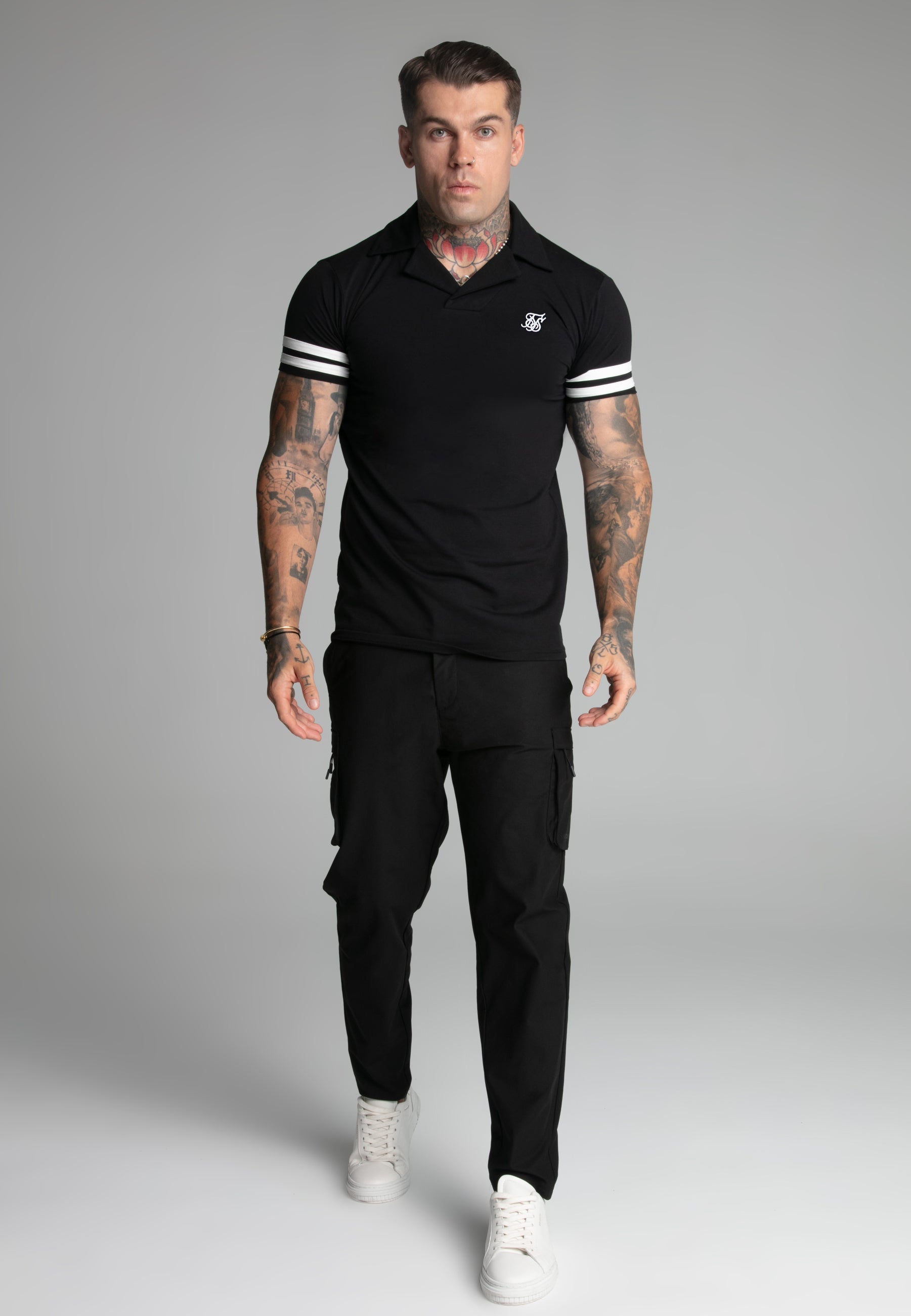 Polo Tournament Revere in nero Magliette SikSilk