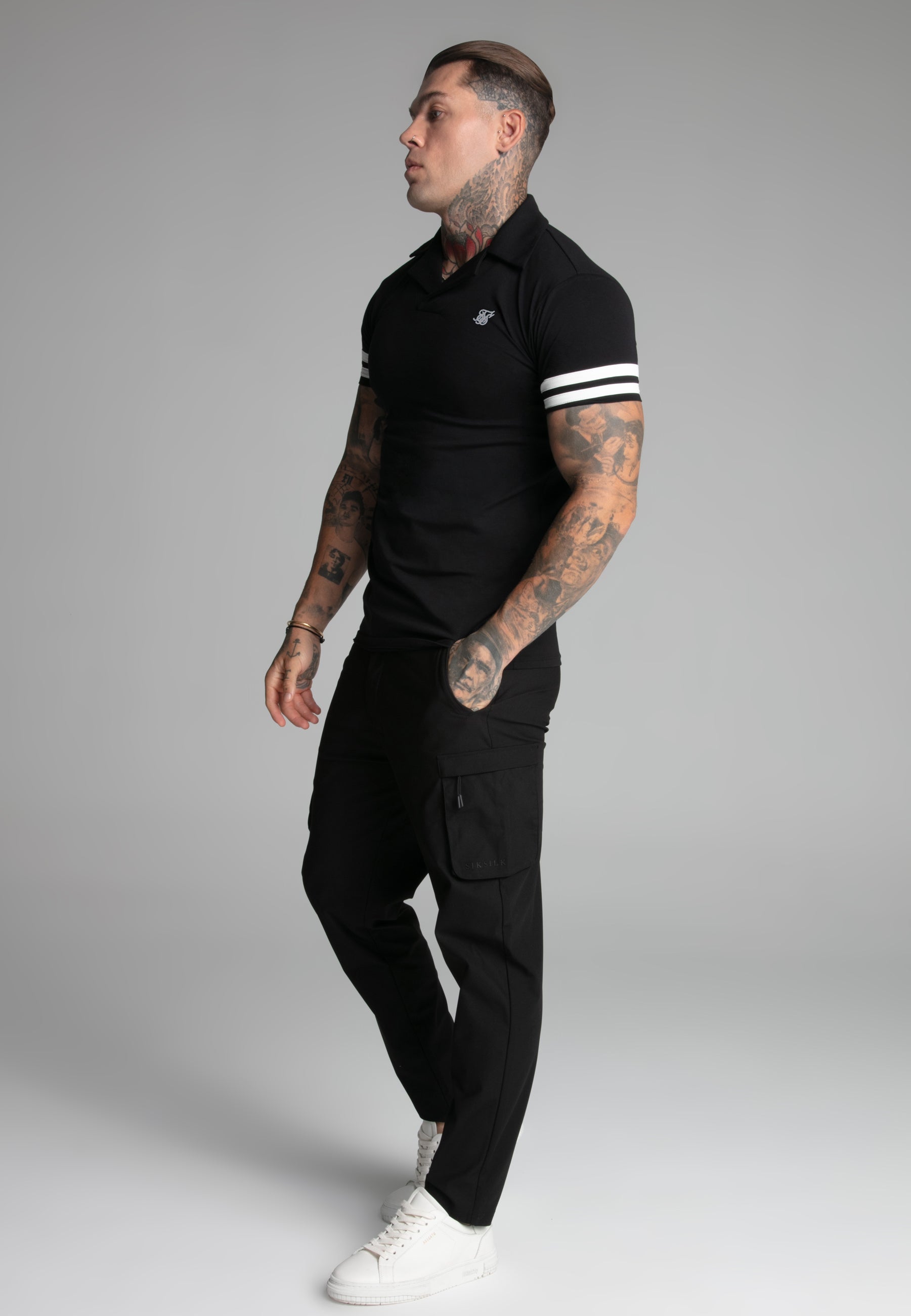 Polo Tournament Revere in nero Magliette SikSilk