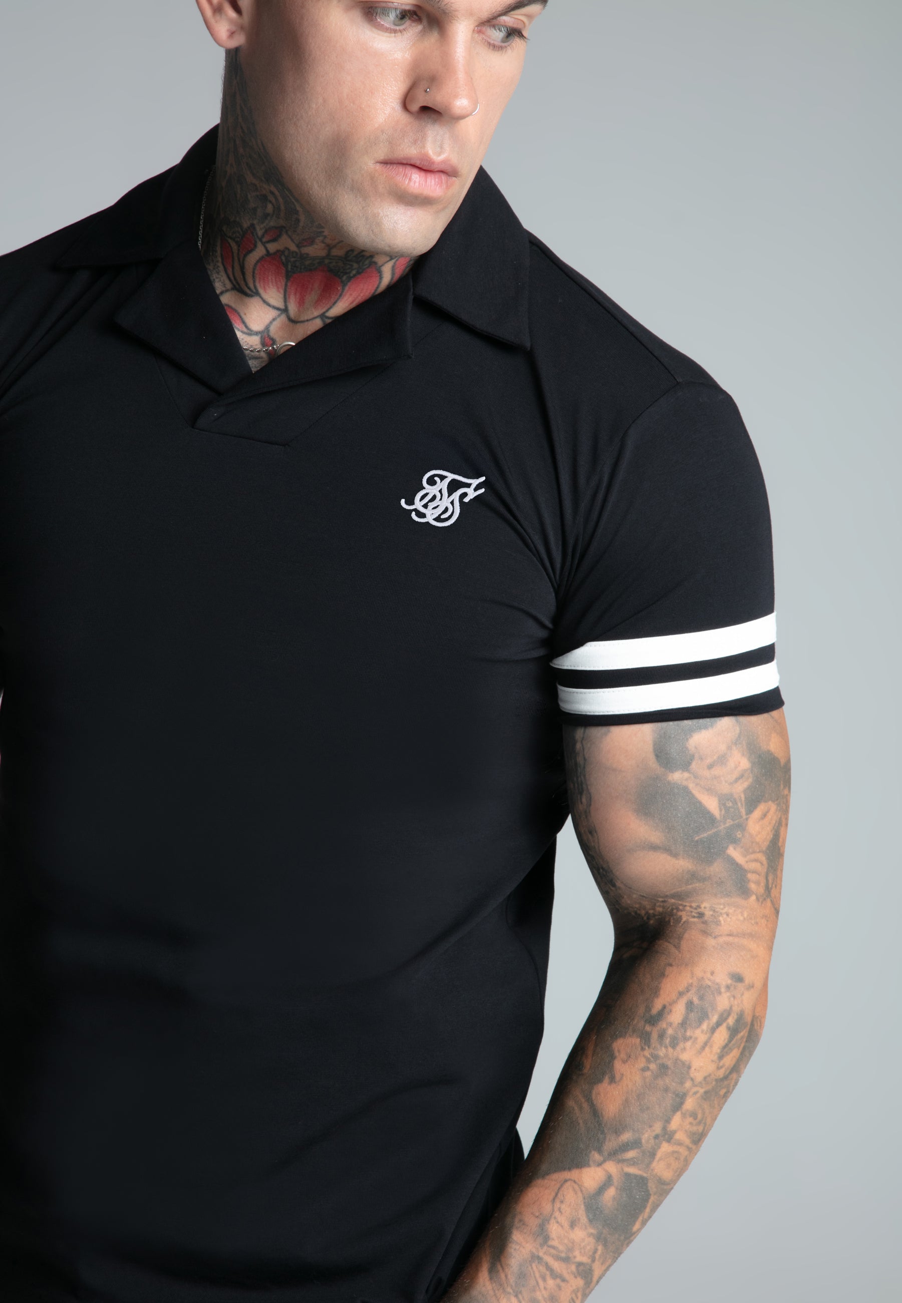 Polo Tournament Revere in nero Magliette SikSilk