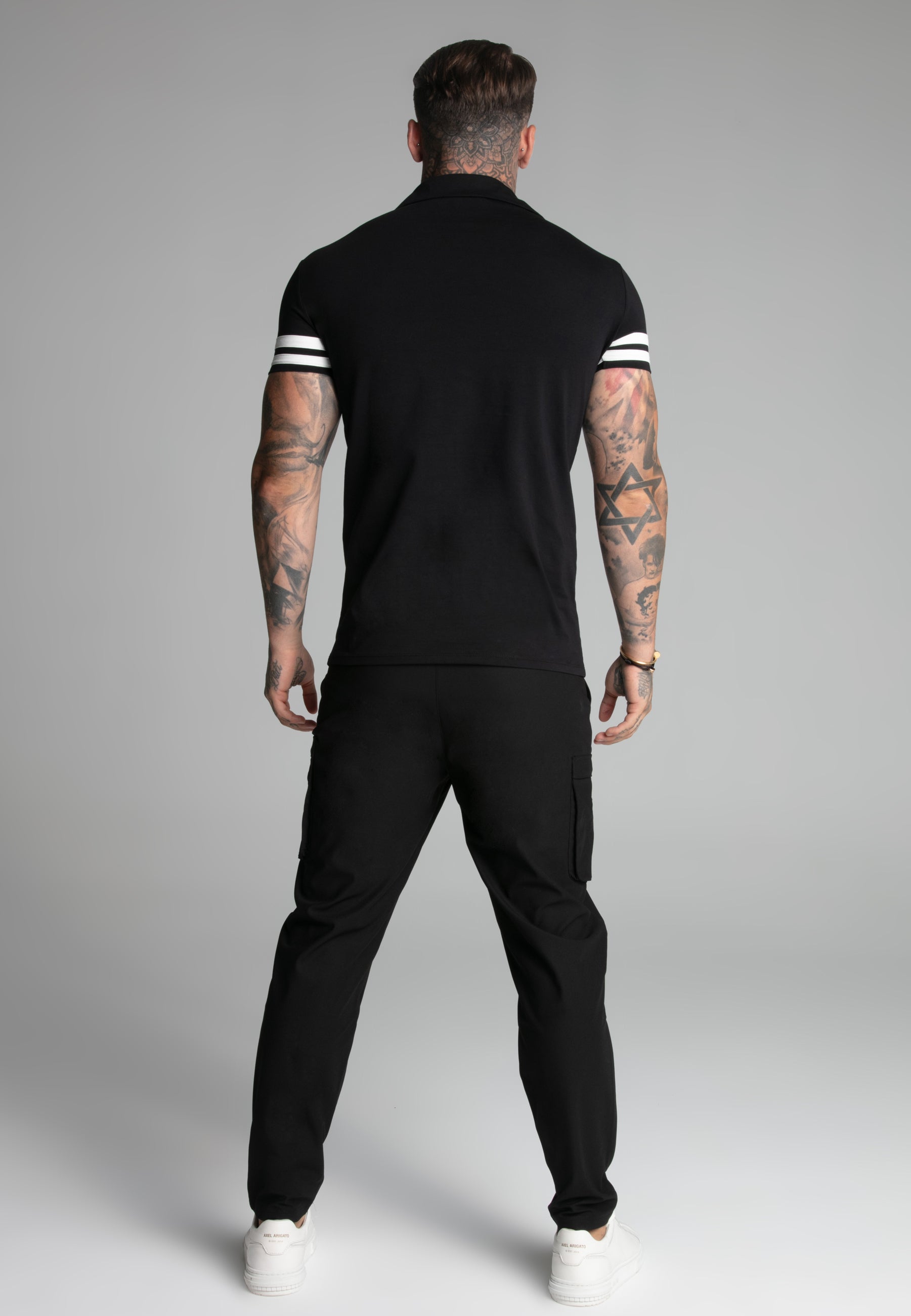 Polo Tournament Revere in nero Magliette SikSilk
