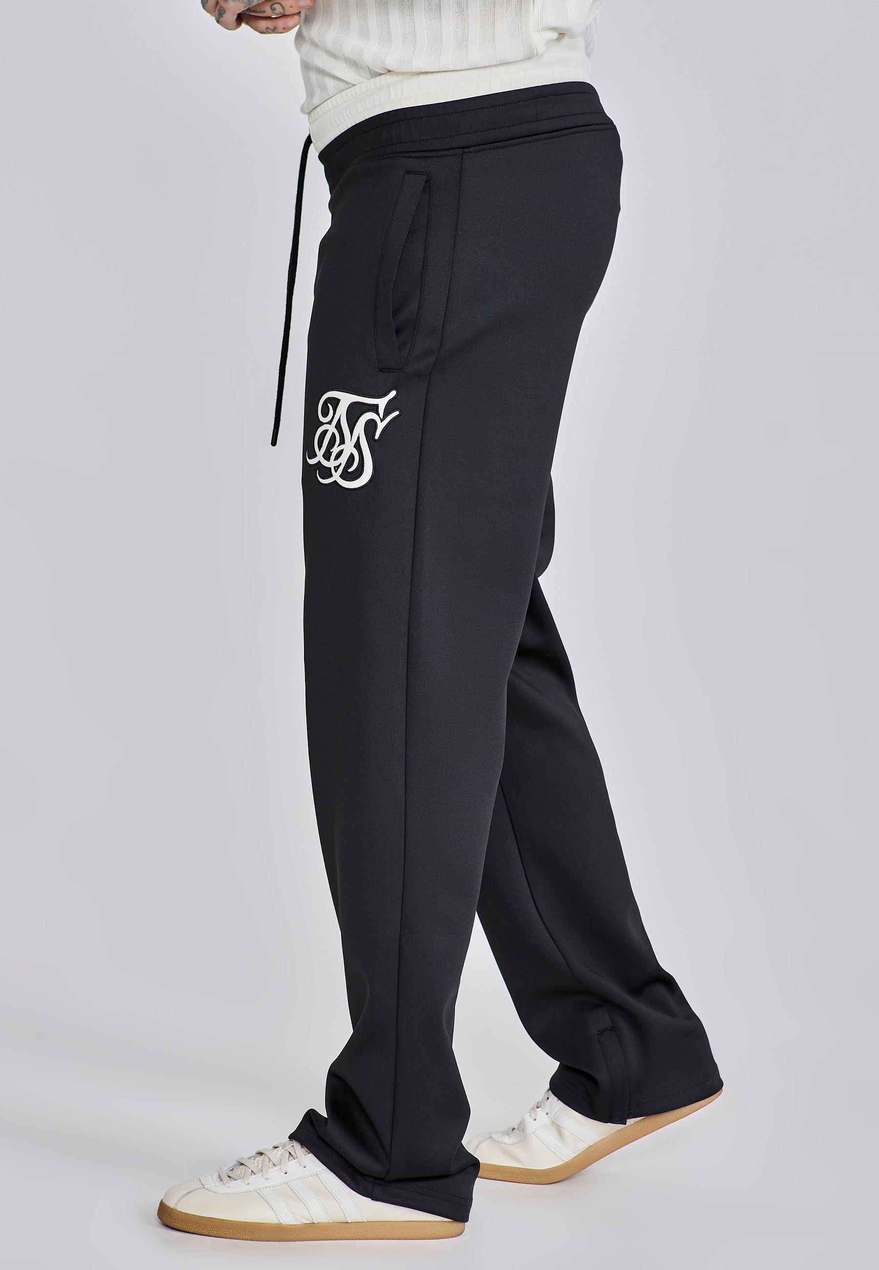 Pantaloni da corsa in nero Pantaloni SikSilk
