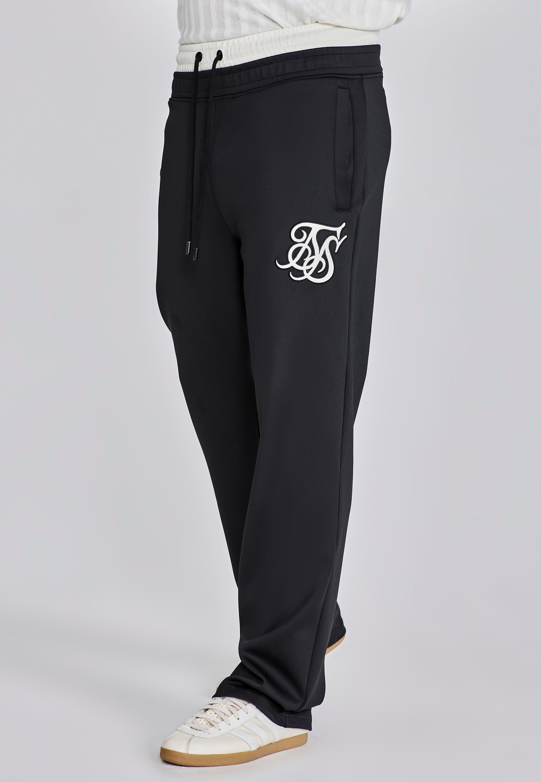 Pantaloni da corsa in nero Pantaloni SikSilk