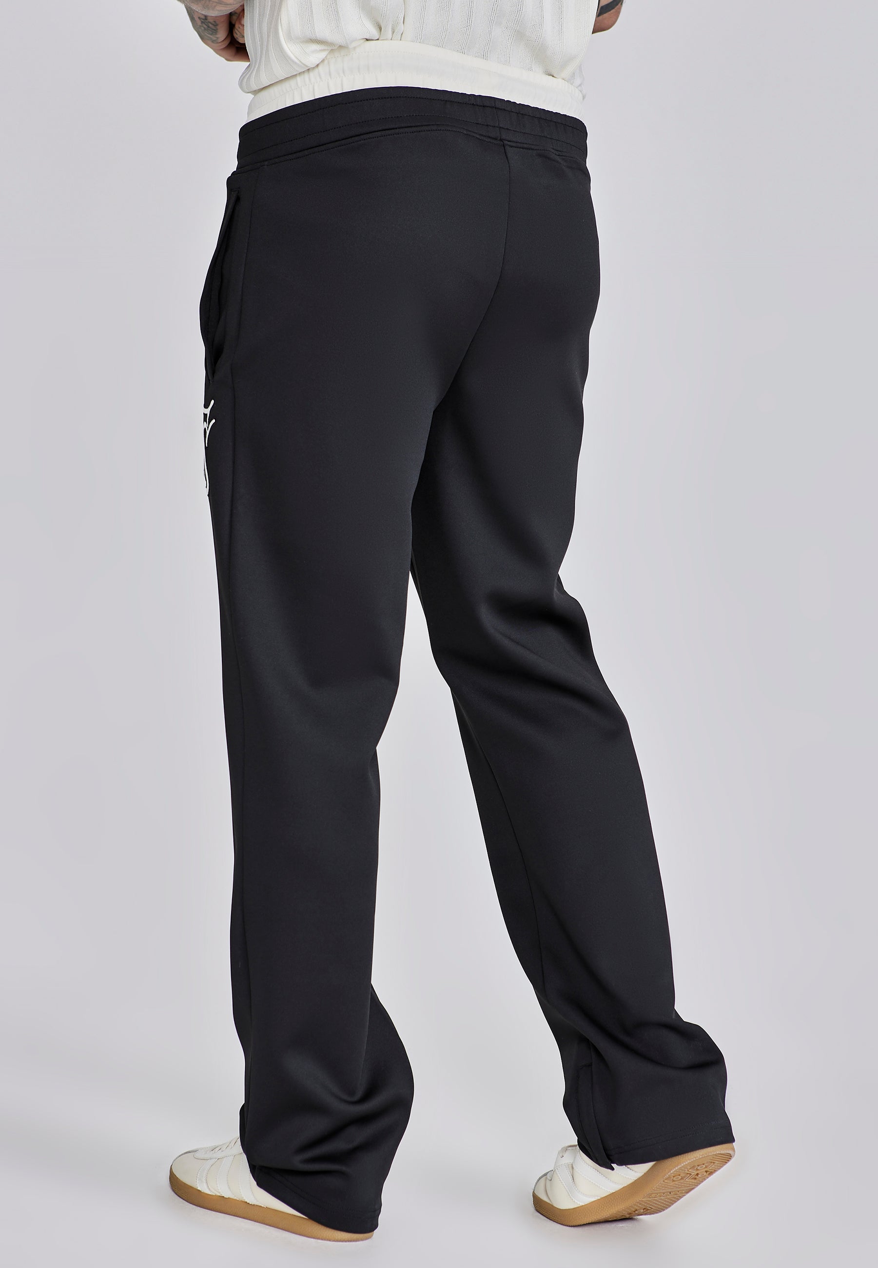 Pantaloni da corsa in nero Pantaloni SikSilk
