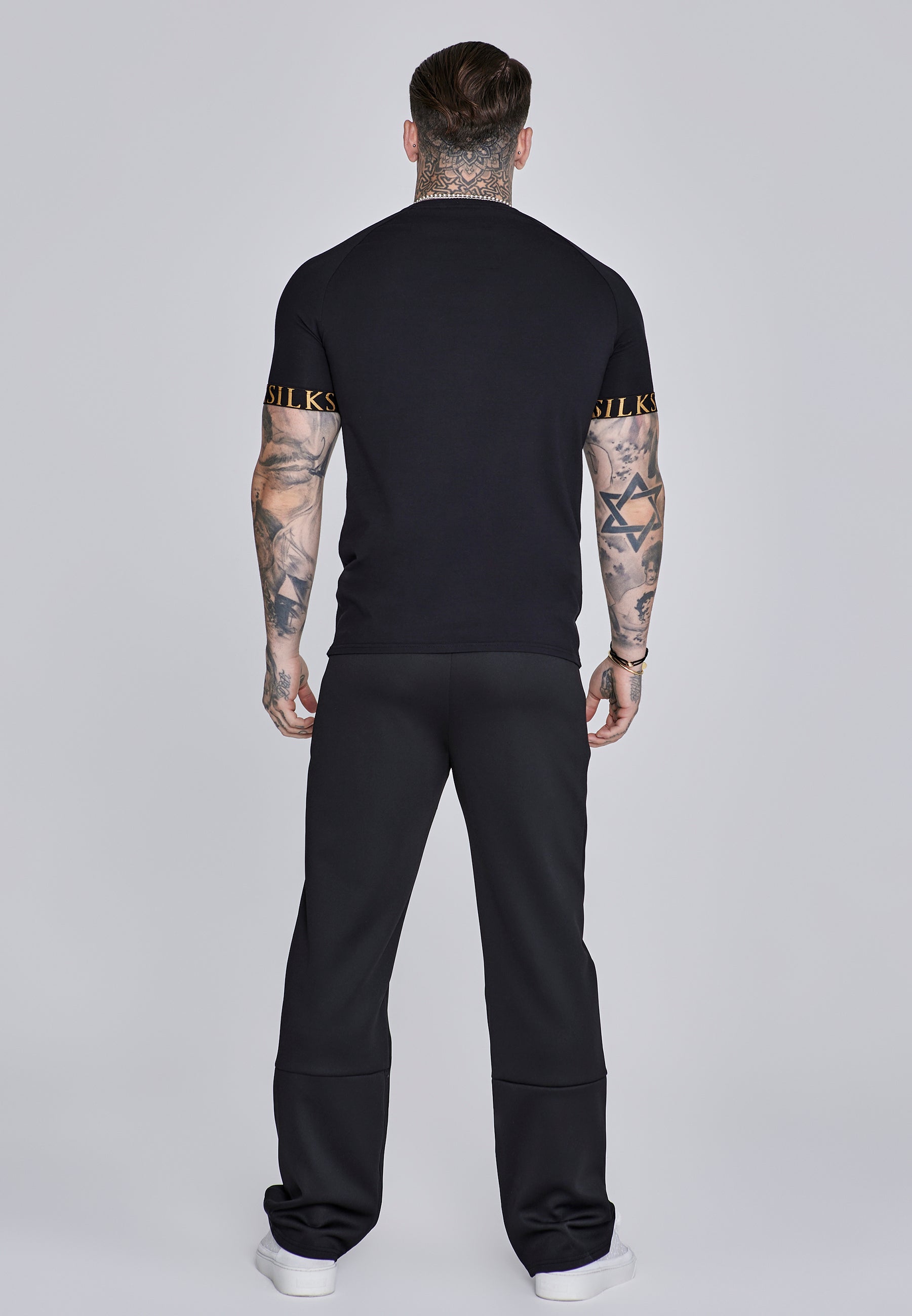 Pantaloni da corsa in nero Pantaloni SikSilk
